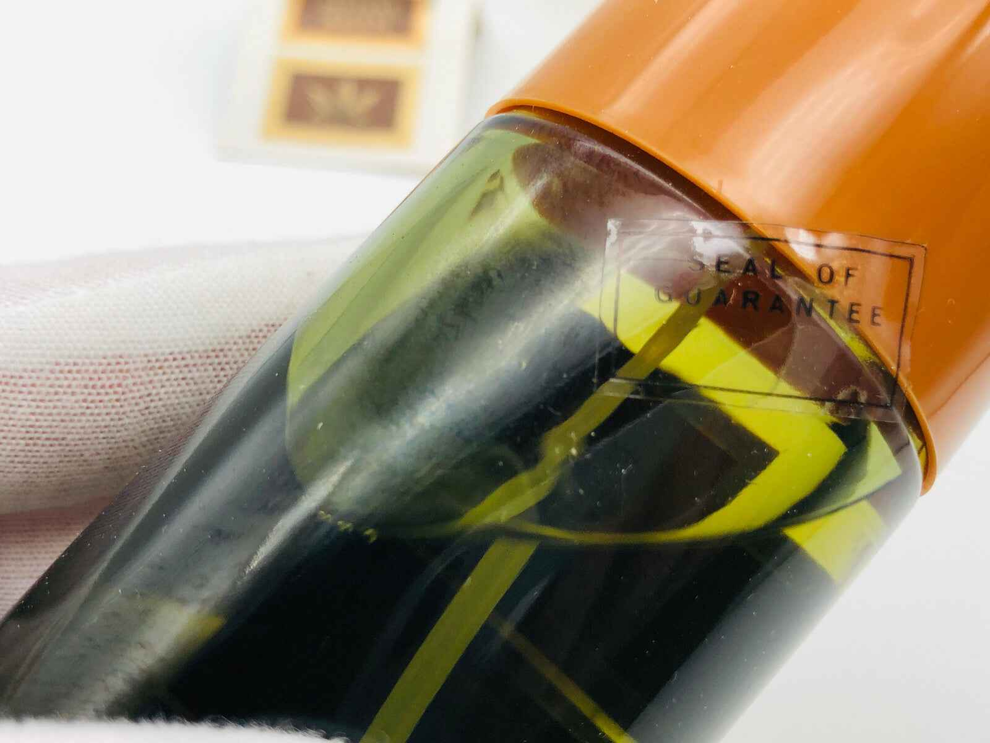 Flacone di ADAM EAU DE BRUYERE VINTAGE profumo con etichetta di garanzia e dettagli eleganti