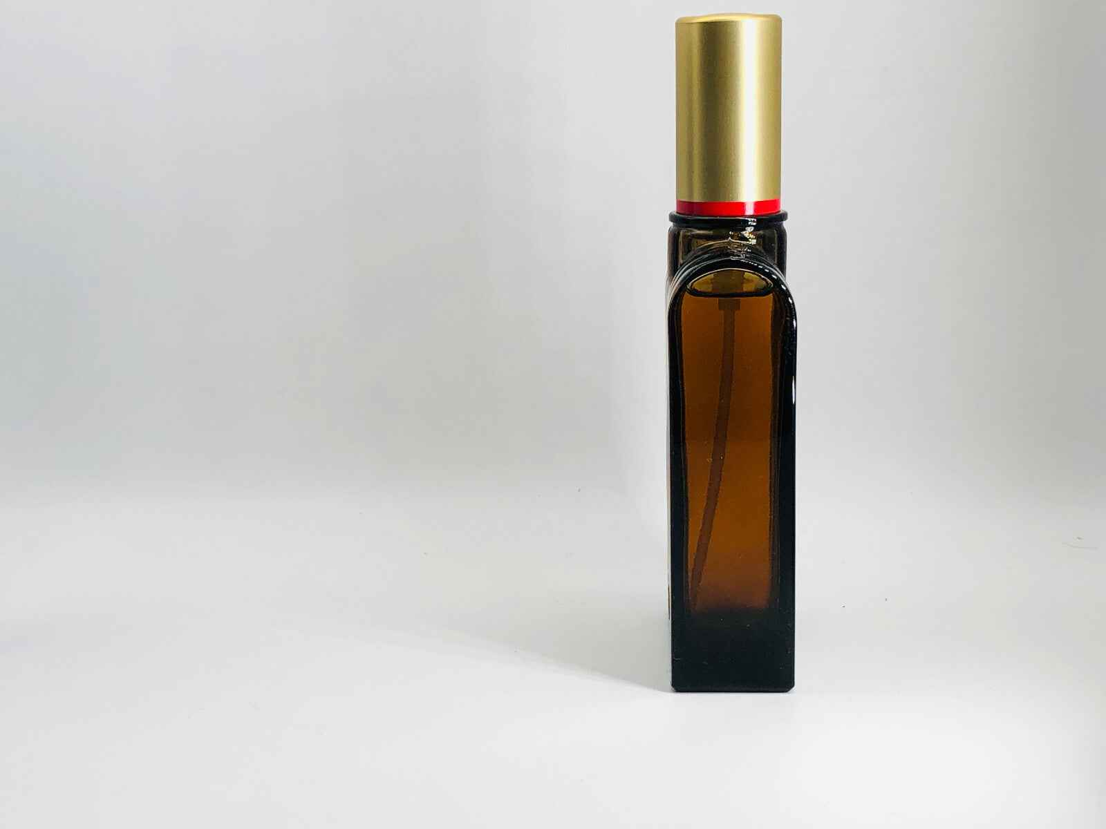 Flacone di profumo Aramis 900 Herbal Vintage con tappo dorato e design elegante