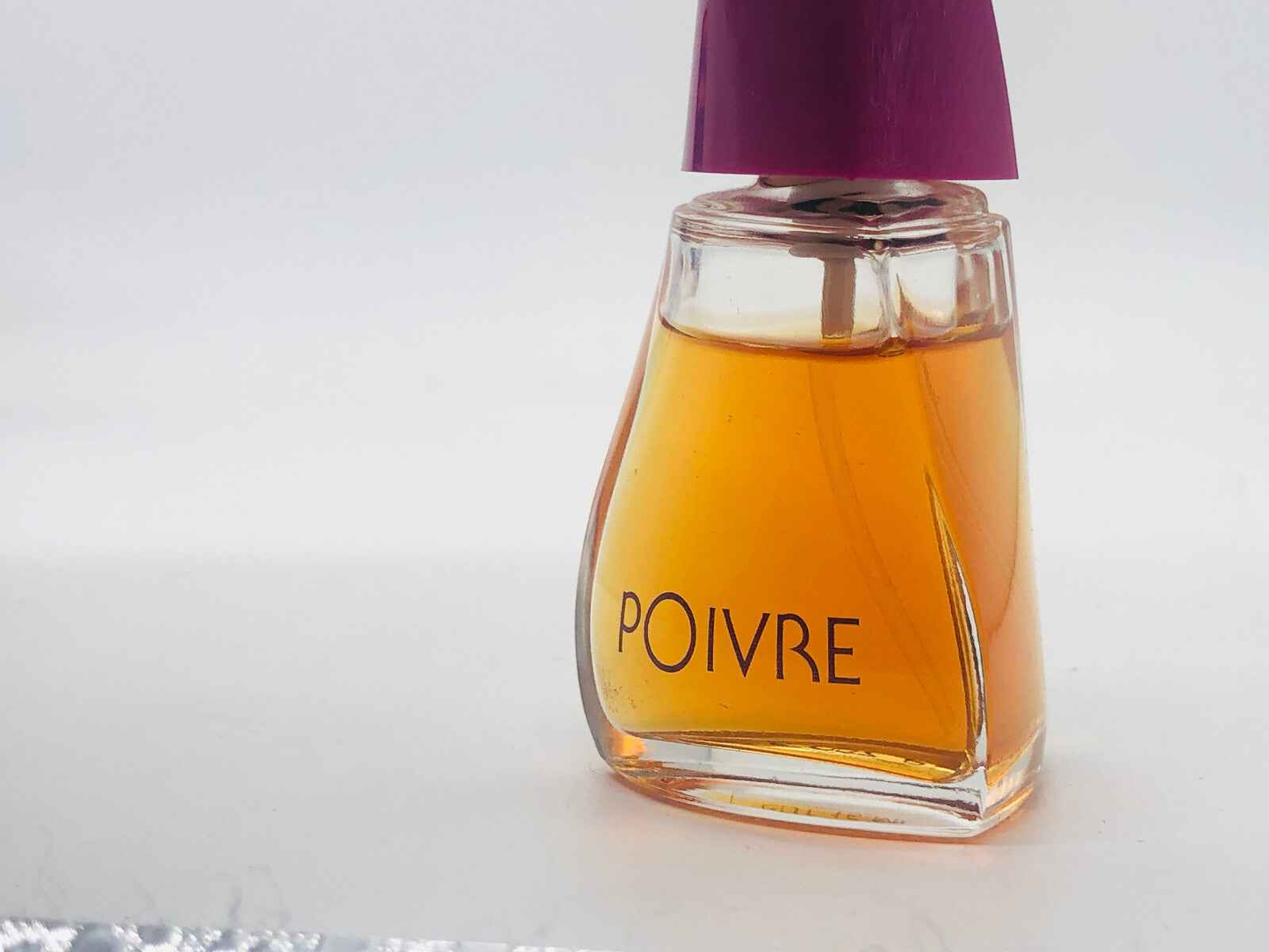 Profumo Vintage Atkinsons Poivre in bottle with a unique design and vibrant liquid color