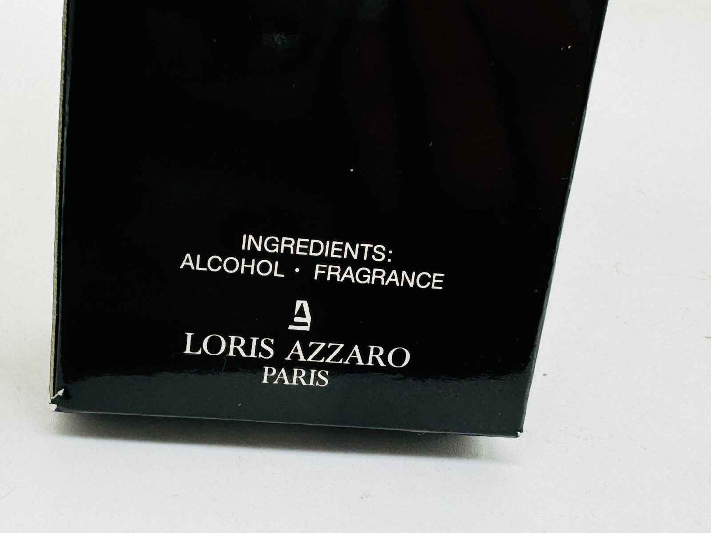Scatola del profumo Azzaro Pour Homme Vintage con ingredienti alcol e fragranza ben visibili
