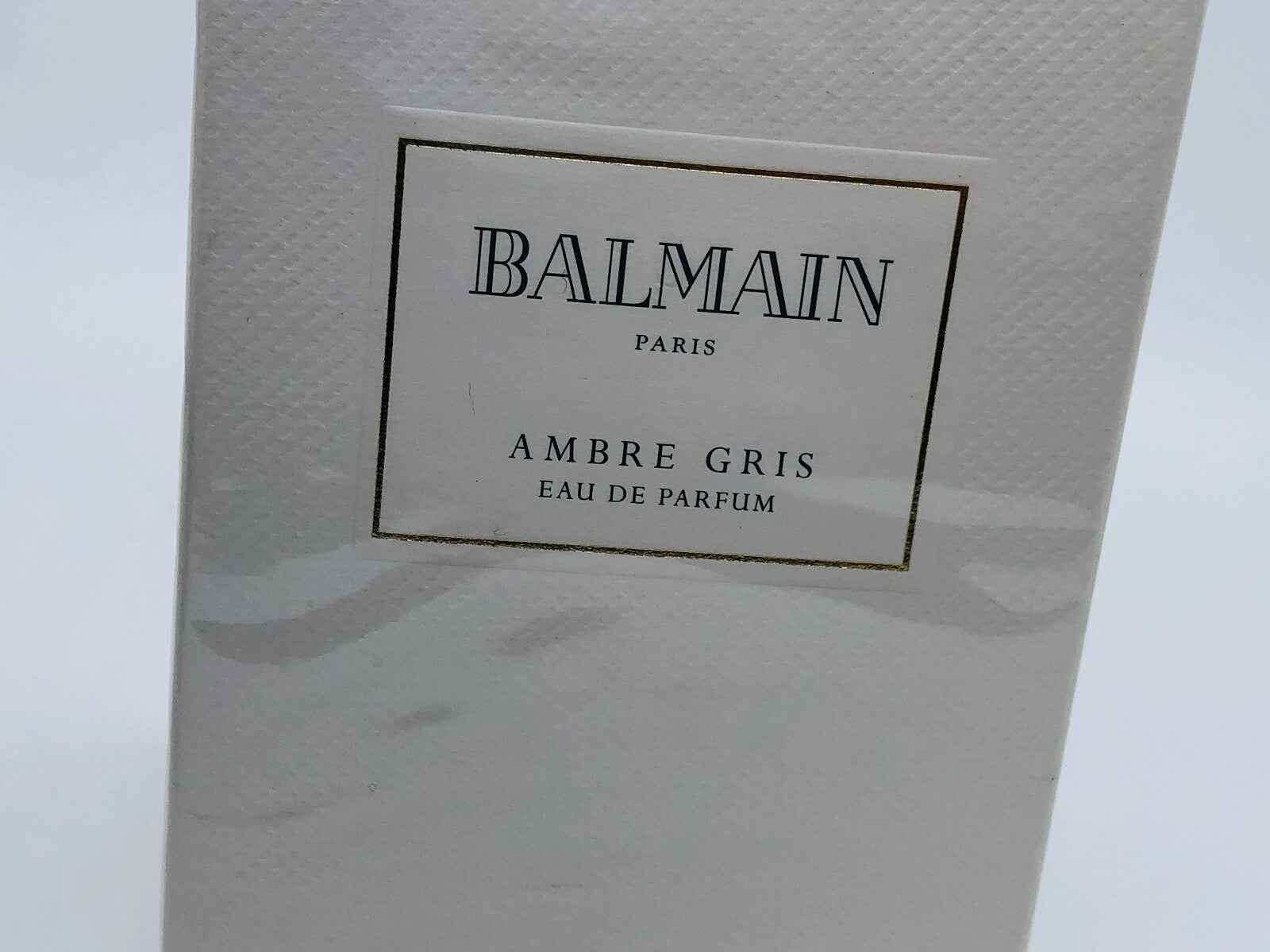 Scatola di profumo Balmain Ambre Gris Vintage con elegante design in bianco e oro