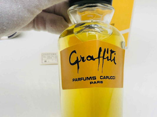 Profumo Capucci Graffiti Vintage in bottiglia di vetro con etichetta gialla e scritta nera