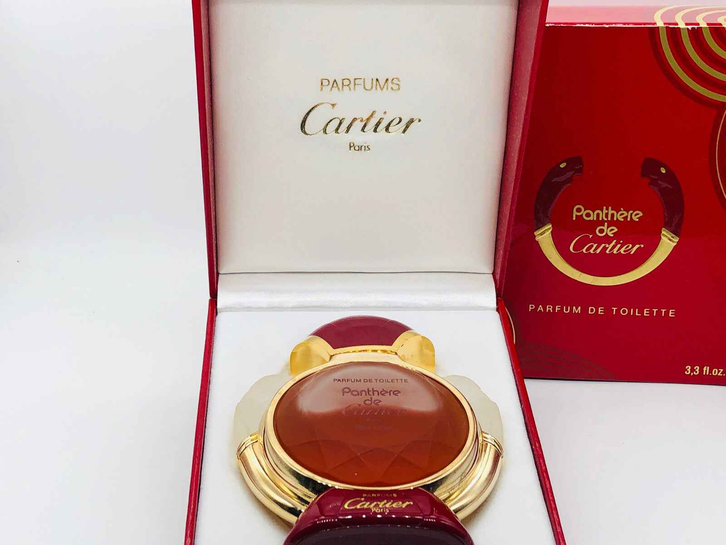 Profumo Panthere Cartier Vintage in confezione elegante con flacone dorato e dettagli rossi
