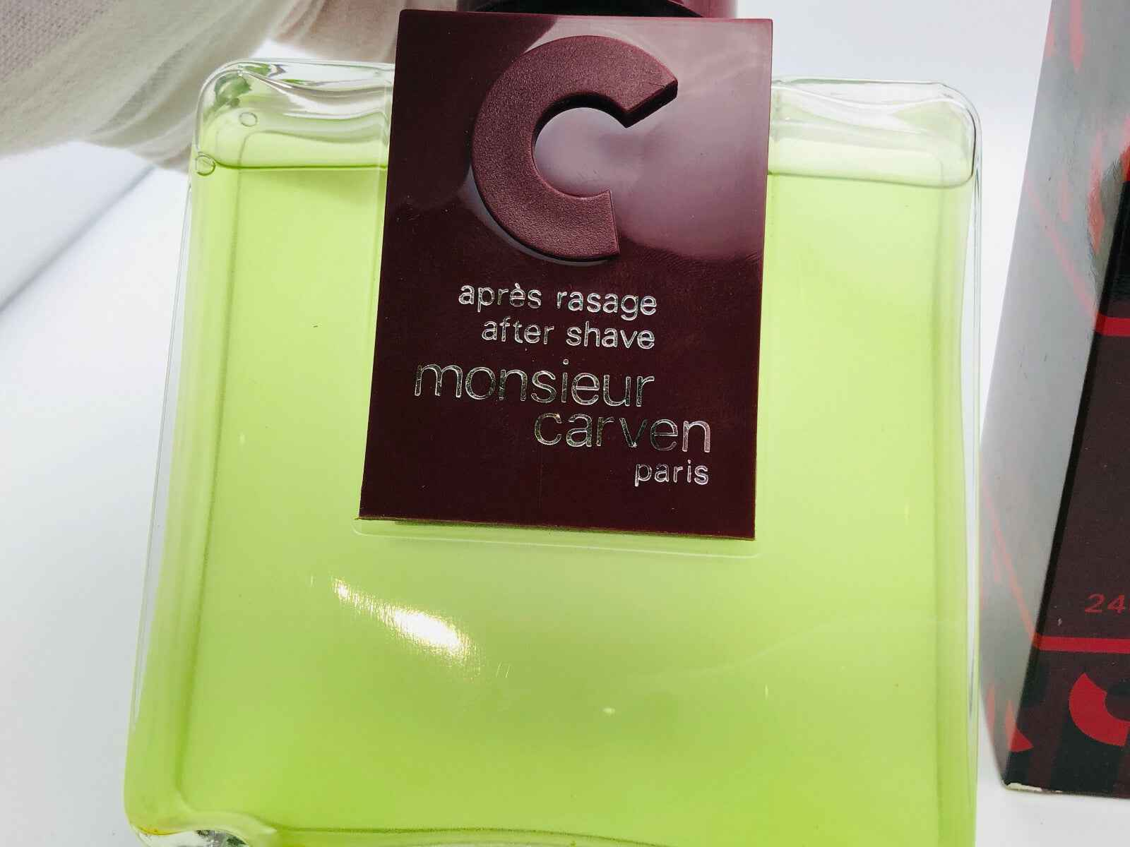 Colonia dopobarba Carven Monsieur Vintage in flacone verde con etichetta elegante