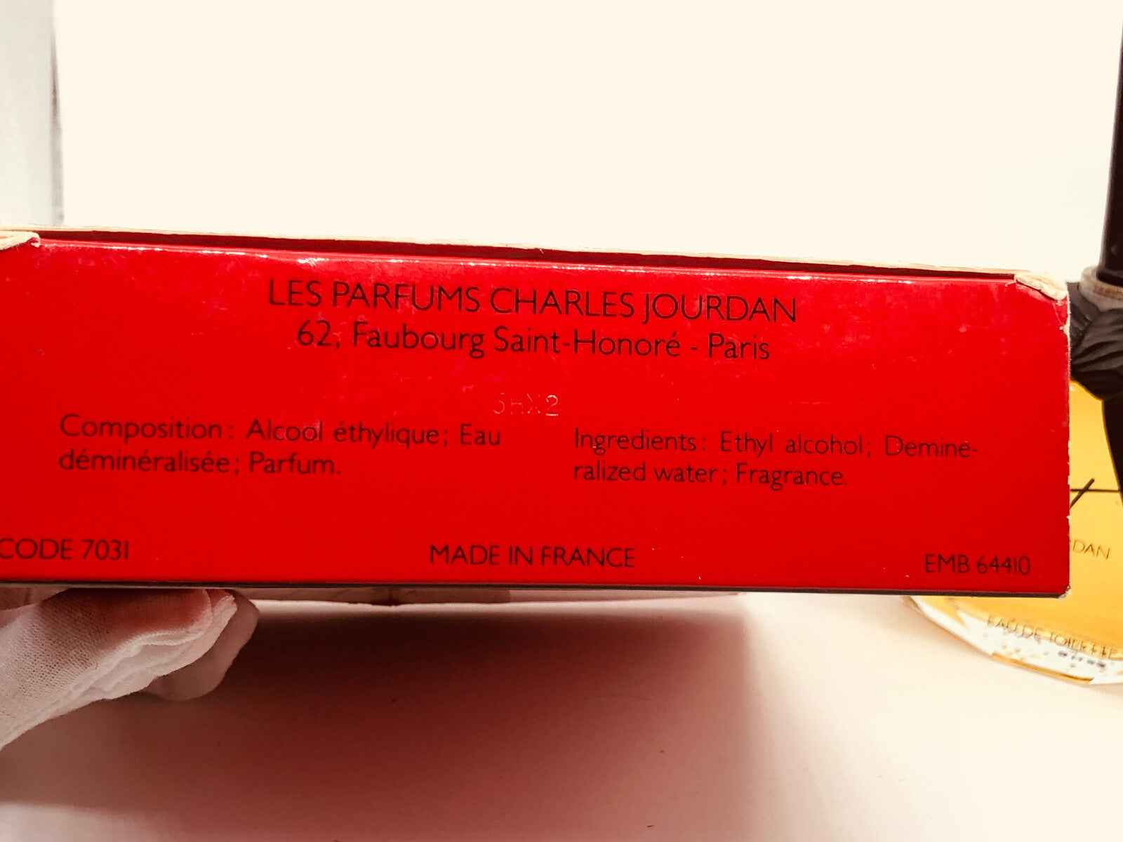 Scatola di profumo Insolent Charles Jourdan con ingredienti e dettagli in francese.