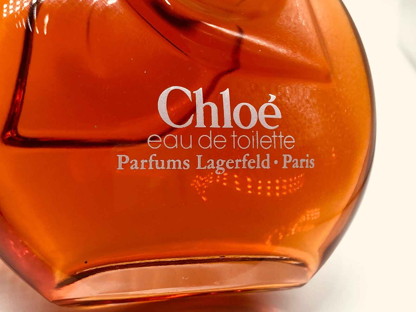 Flacone di profumo Chloé eau de toilette Karl Lagerfeld Vintage con design elegante in vetro arancione