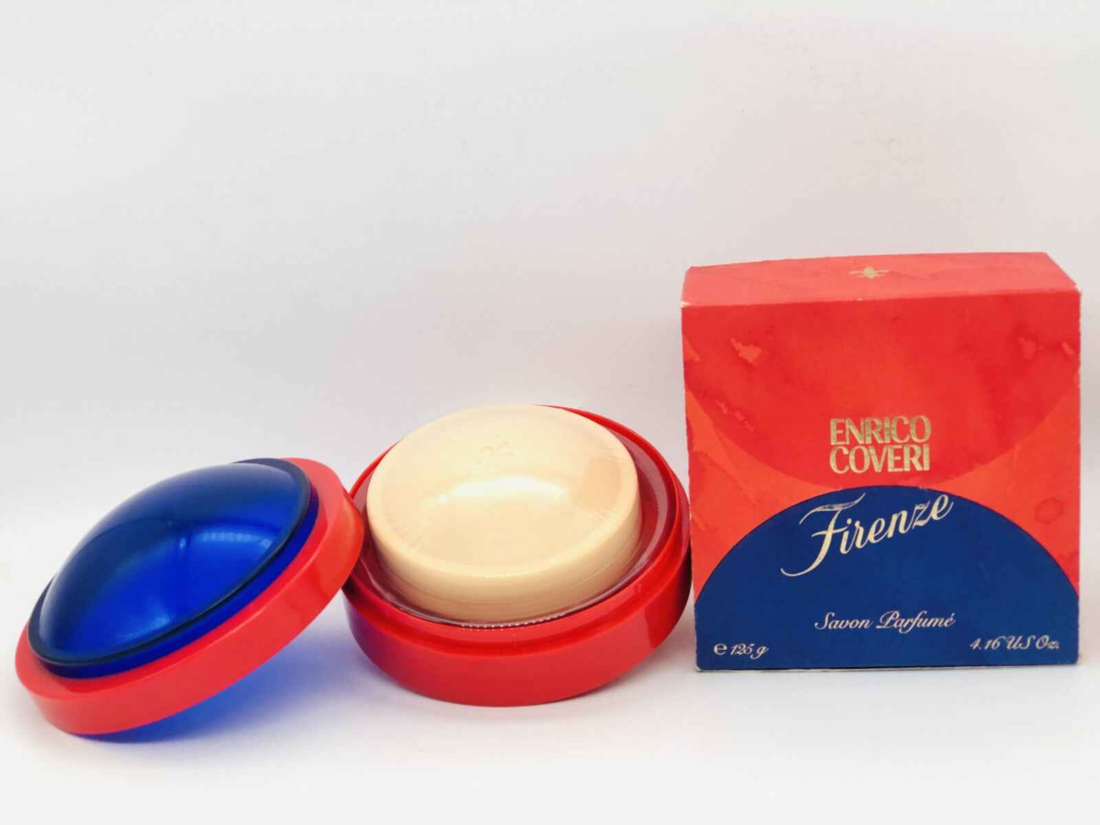 Profumo vintage Enrico Coveri Firenze con astucci rosso e blu per un aroma sofisticato