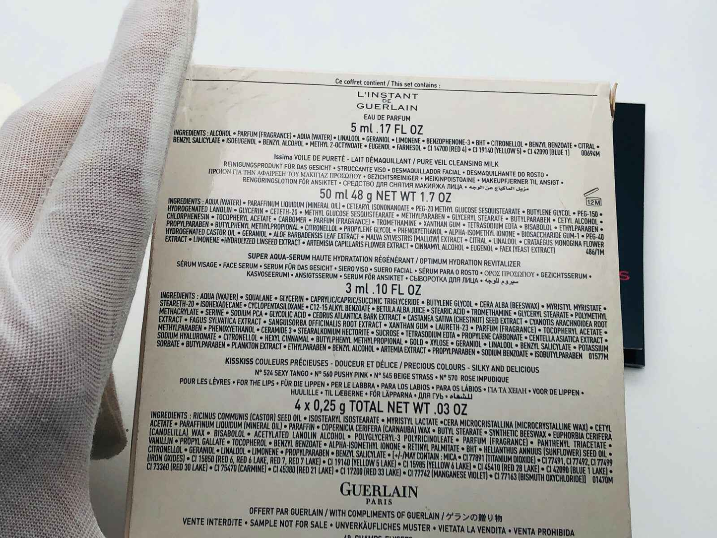 Retro confezione del prodotto L'Instant Guerlain Vintage con dettagli degli ingredienti e delle informazioni.