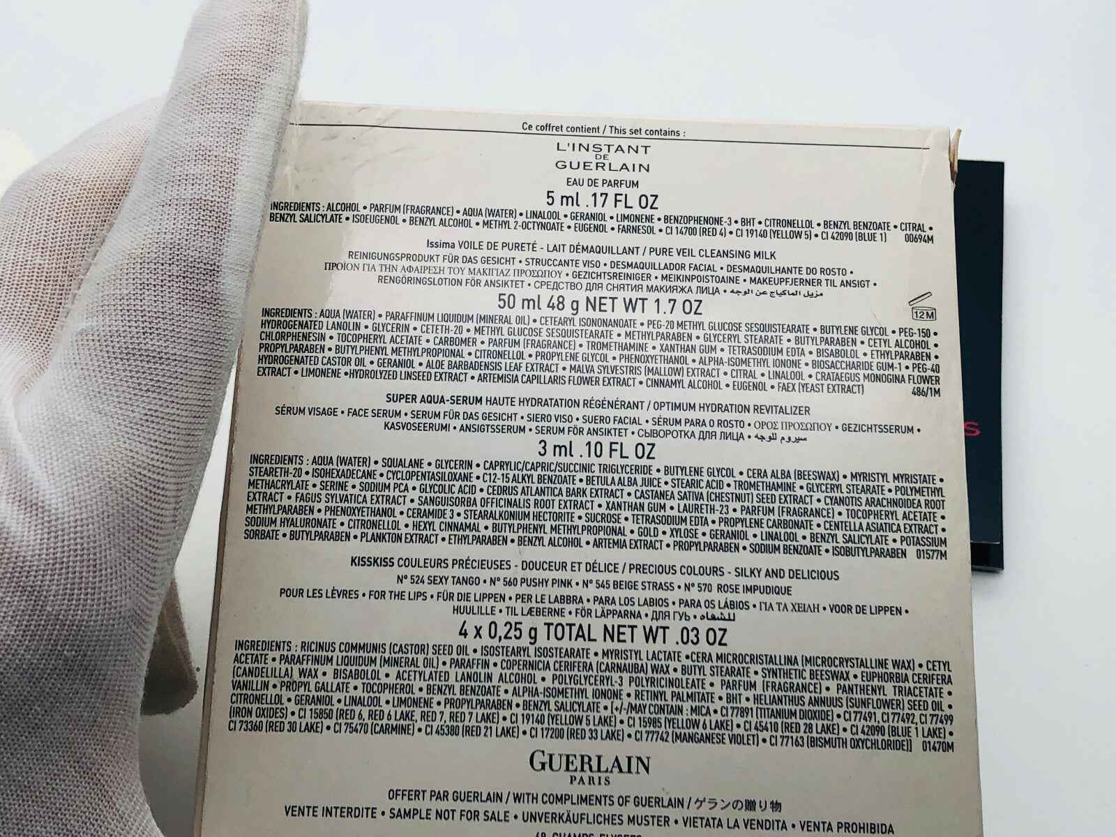 Retro confezione del prodotto L'Instant Guerlain Vintage con dettagli degli ingredienti e delle informazioni.