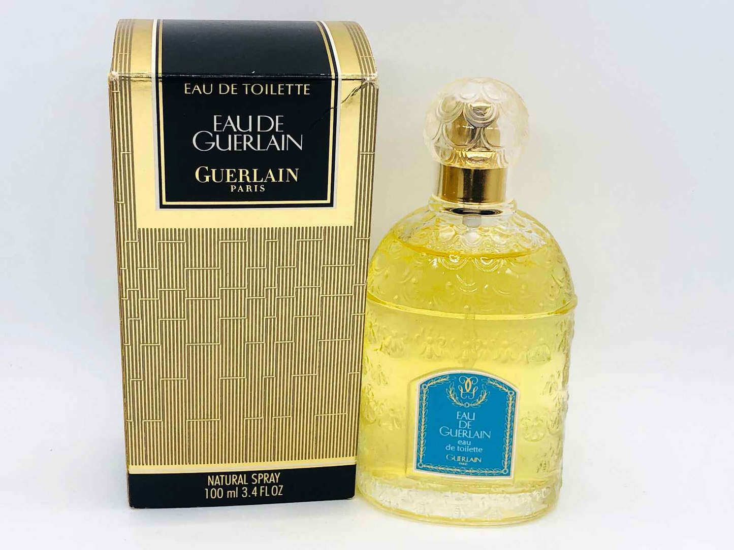 Profumo Eau De Guerlain in flacone di vetro decorato con confezione elegante da 100 ml
