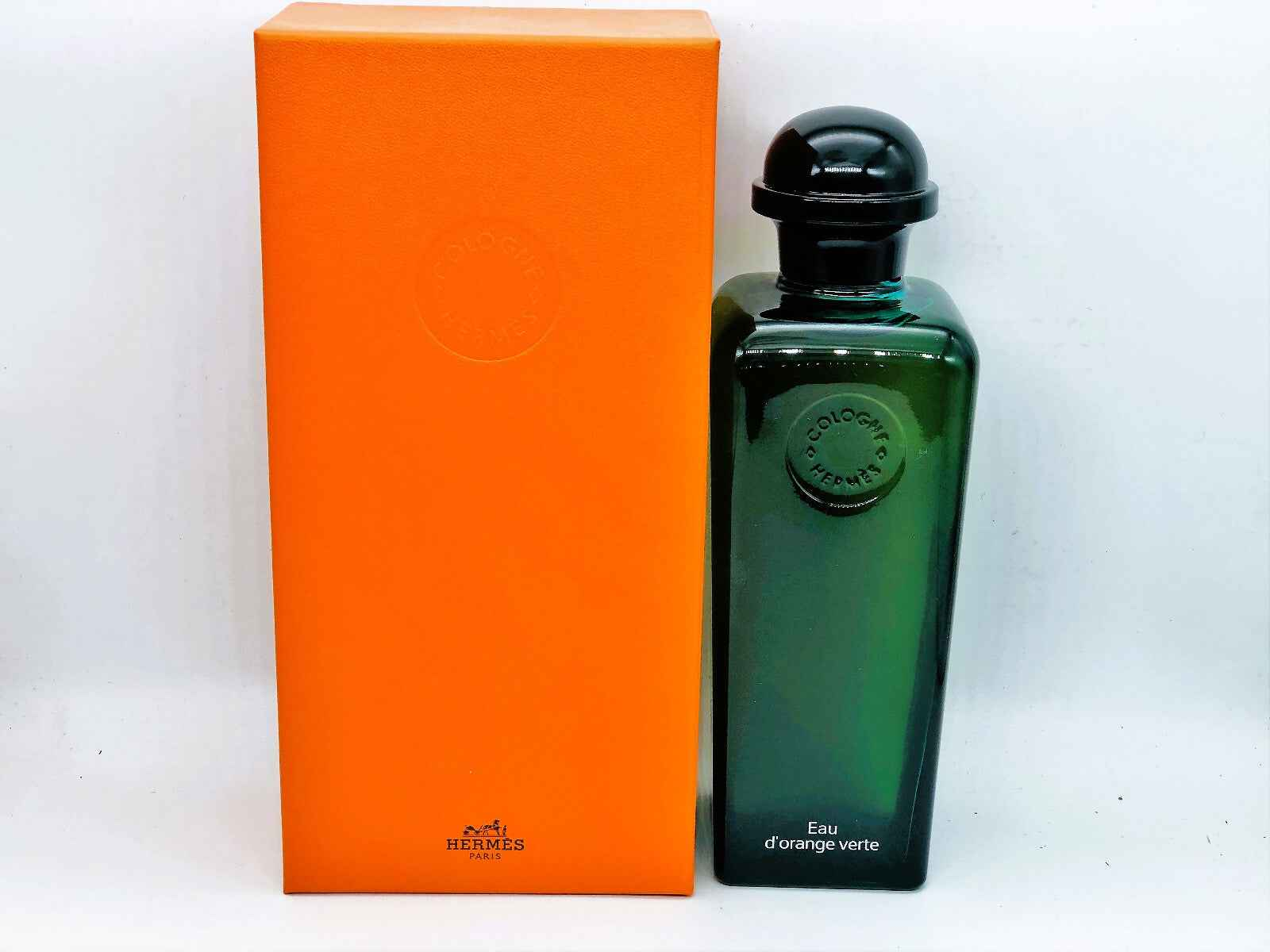 Profumo Hermes Eau D'Orange Verte in bottiglia verde con scatola arancione elegante