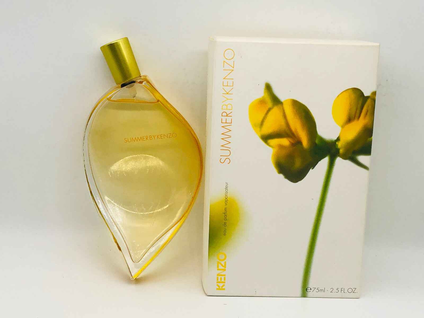 Profumo vintage Summer By Kenzo con flacone a forma di foglia e confezione gialla e bianca