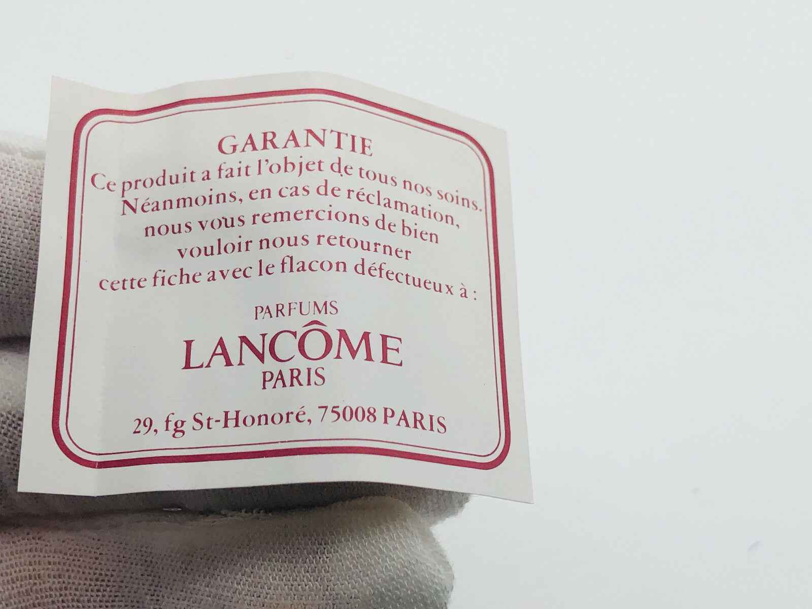 Etichetta di garanzia del prodotto Lancôme con logo e indirizzo di Parigi per Trophee Lancome Vintage