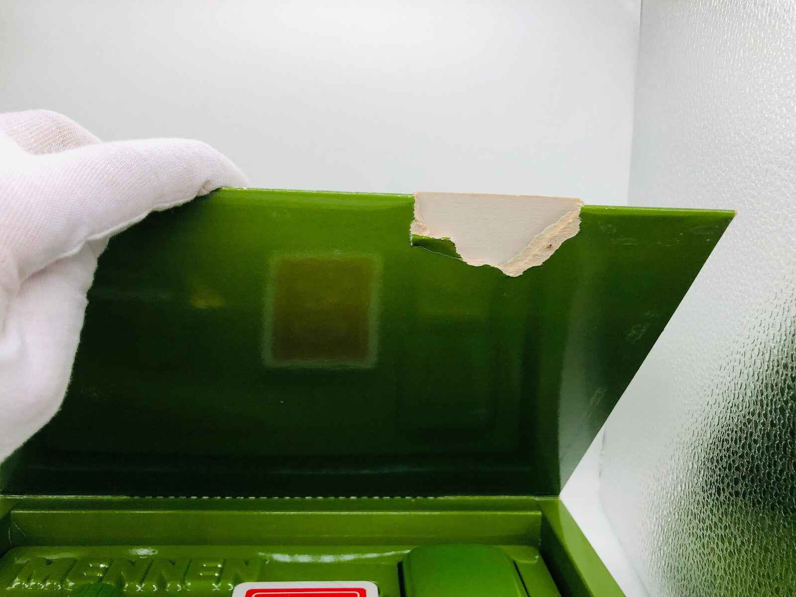 Scatola danneggiata di Profumo Green Tonic Mennen con dettagli sulla parte superiore verde