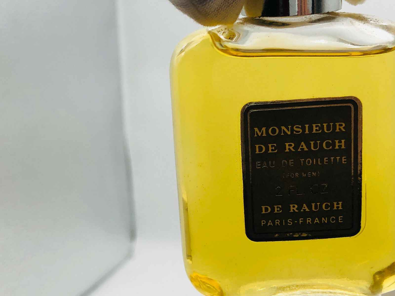 Profumo Monsieur De Rauch Vintage in flacone di vetro con etichetta elegante per uomo