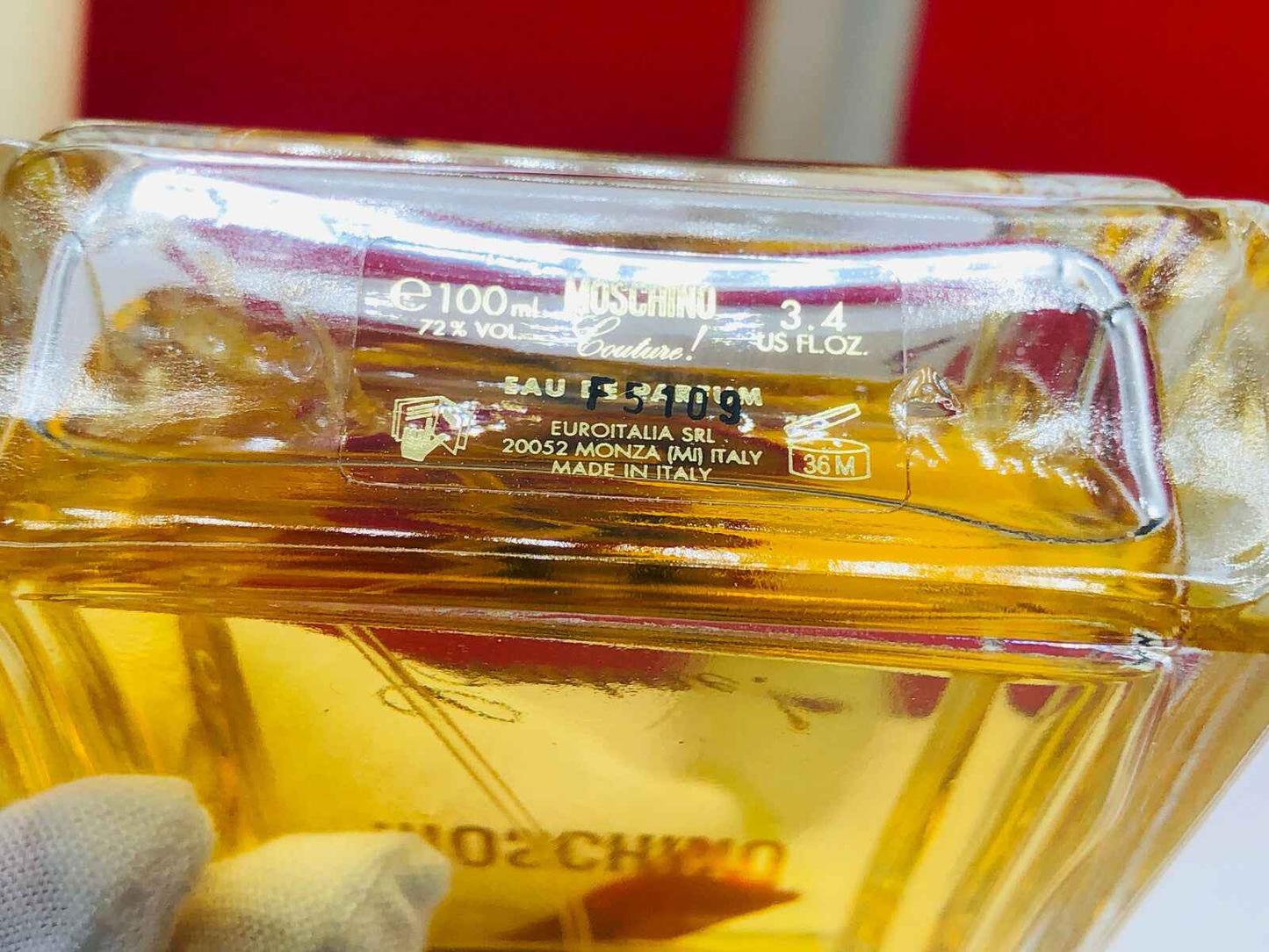 Flacone di profumo Moschino Couture Vintage da 100 ml con etichetta dettagliata e colore ambrato