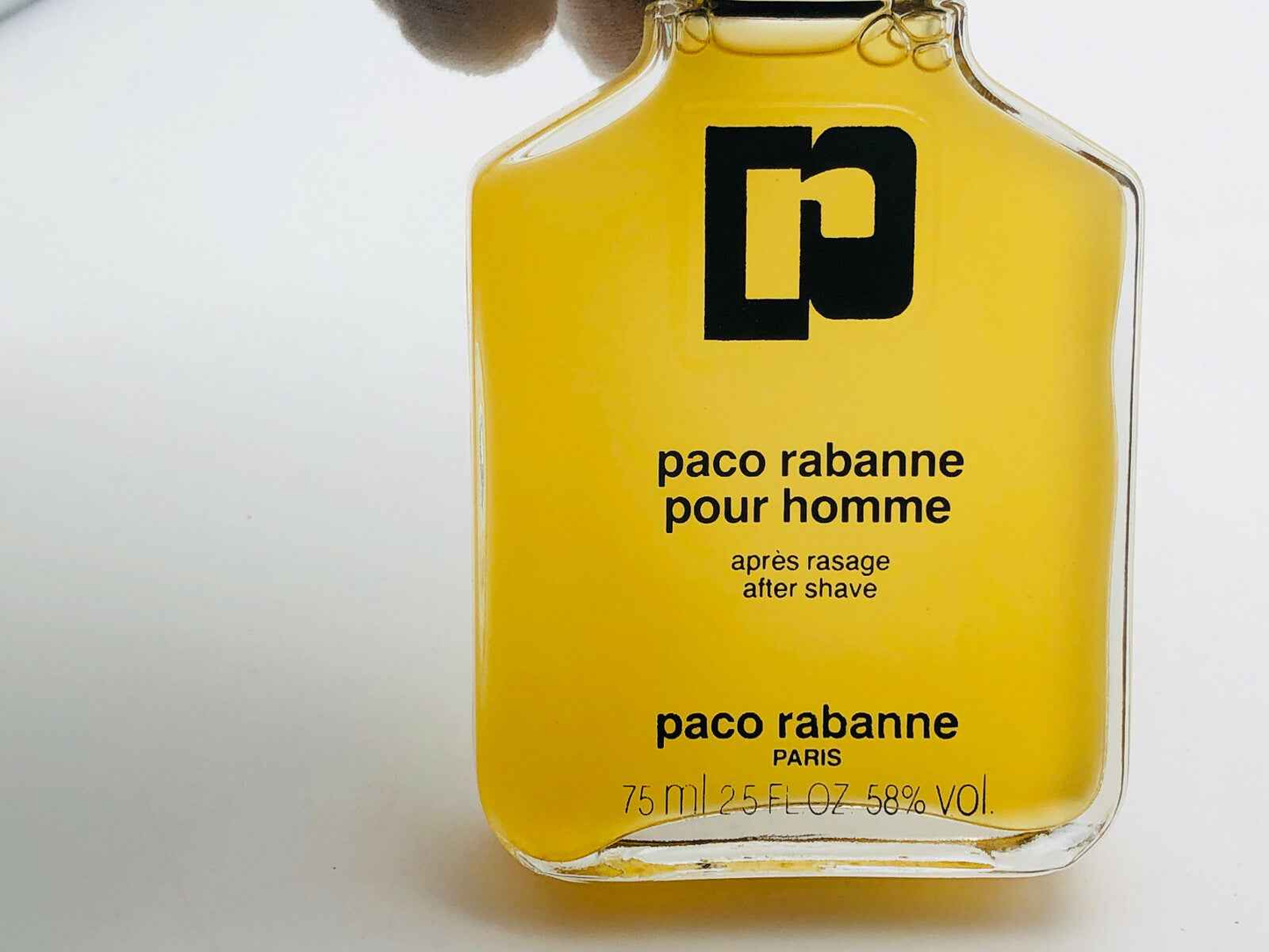 Flacone di dopobarba Paco Rabanne Pour Homme Vintage in vetro da 75 ml con logo distintivo