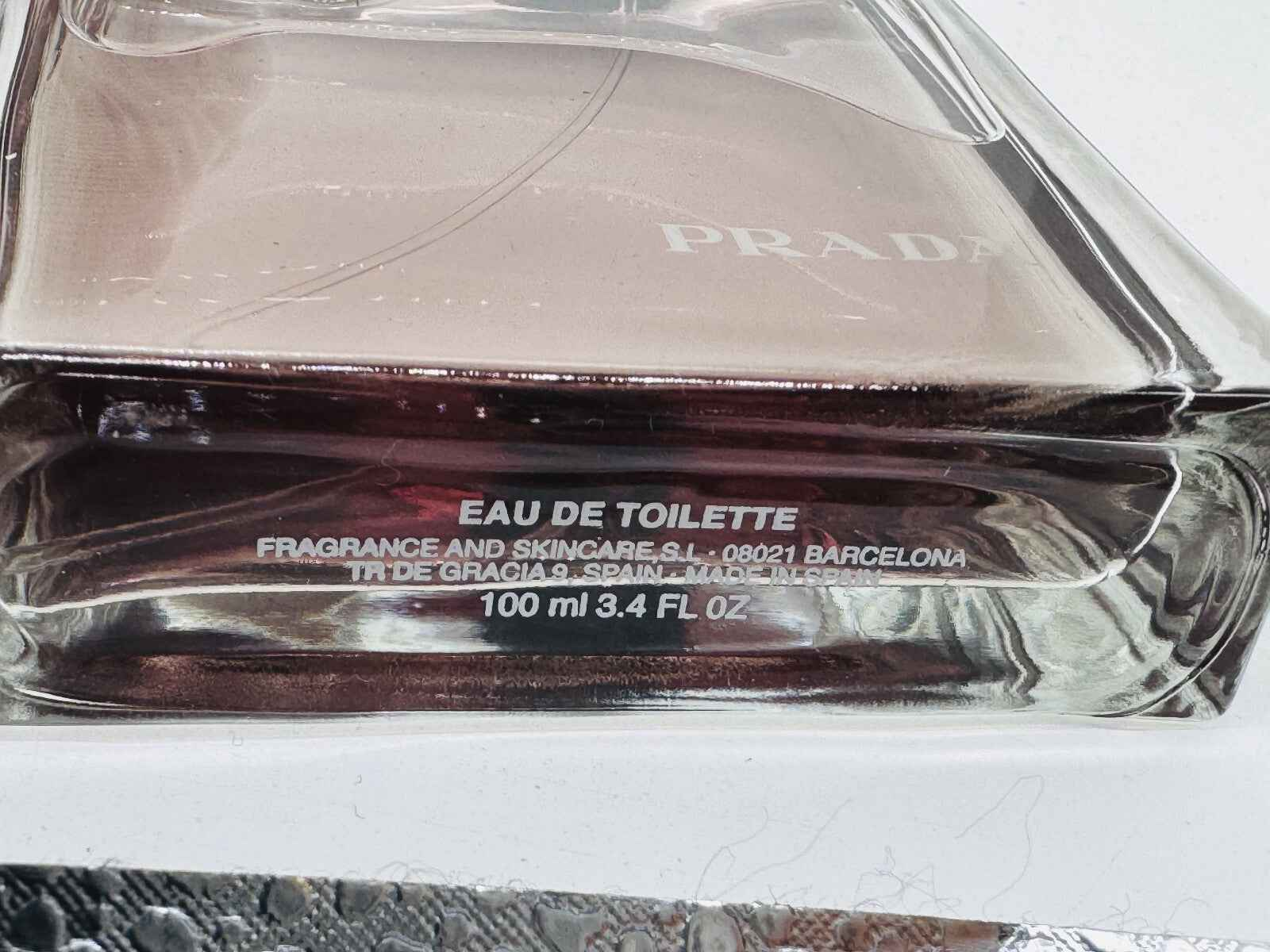 Profumo Prada Amber Pour Homme in bottiglia trasparente da 100ml con design elegante