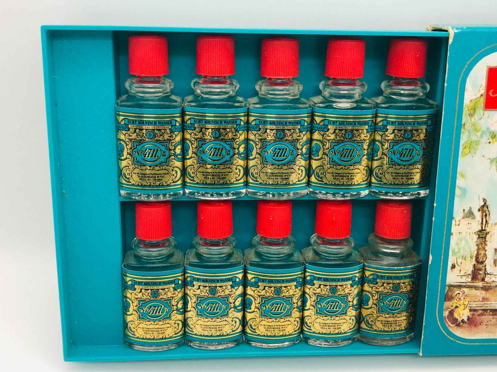 Set di 10 flaconi di Profumo 4711 Vintage con tappi rossi in una confezione azzurra