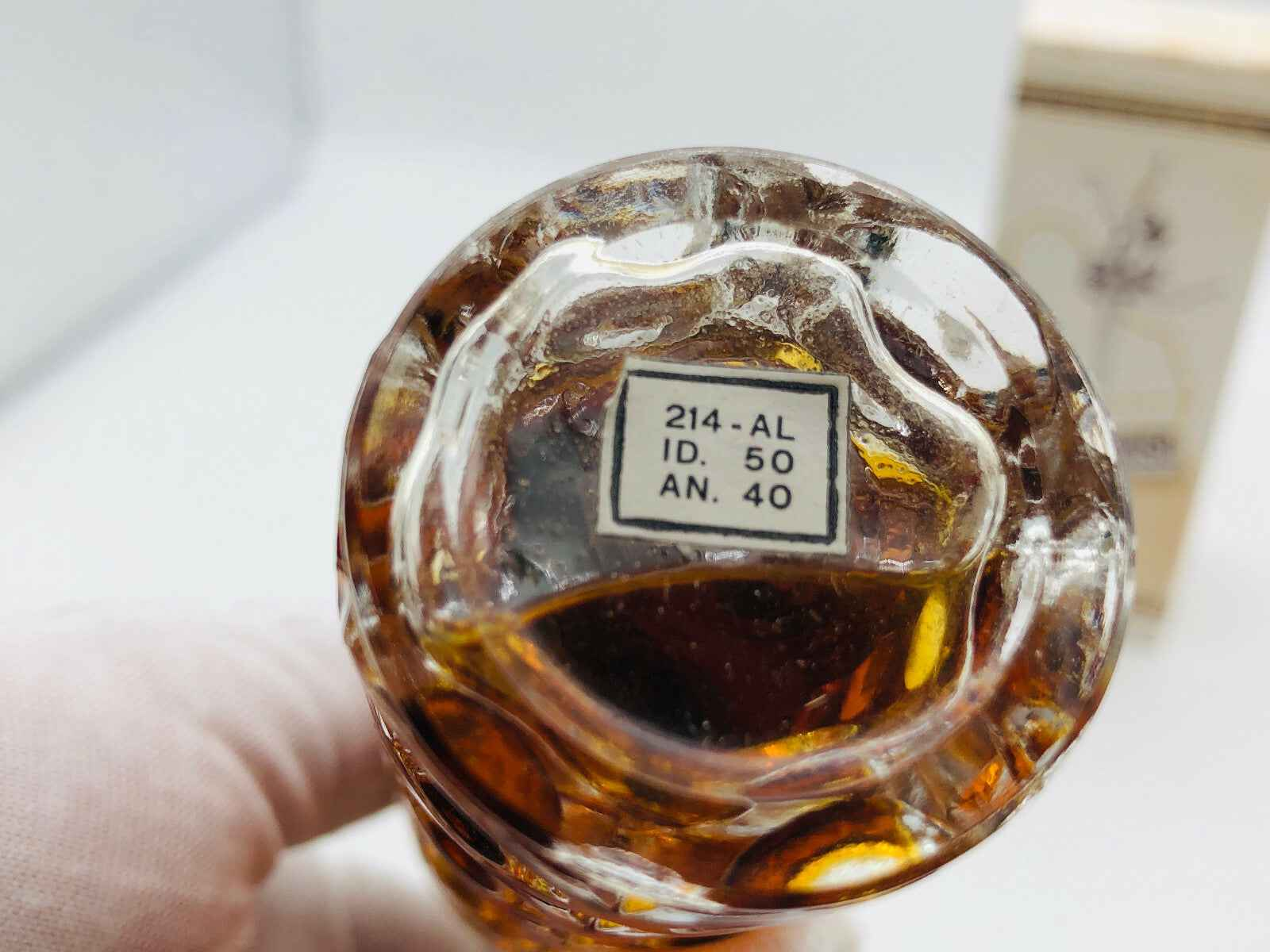 Base di profumo Applauso Gandini con etichetta informativa sul fondo della bottiglia