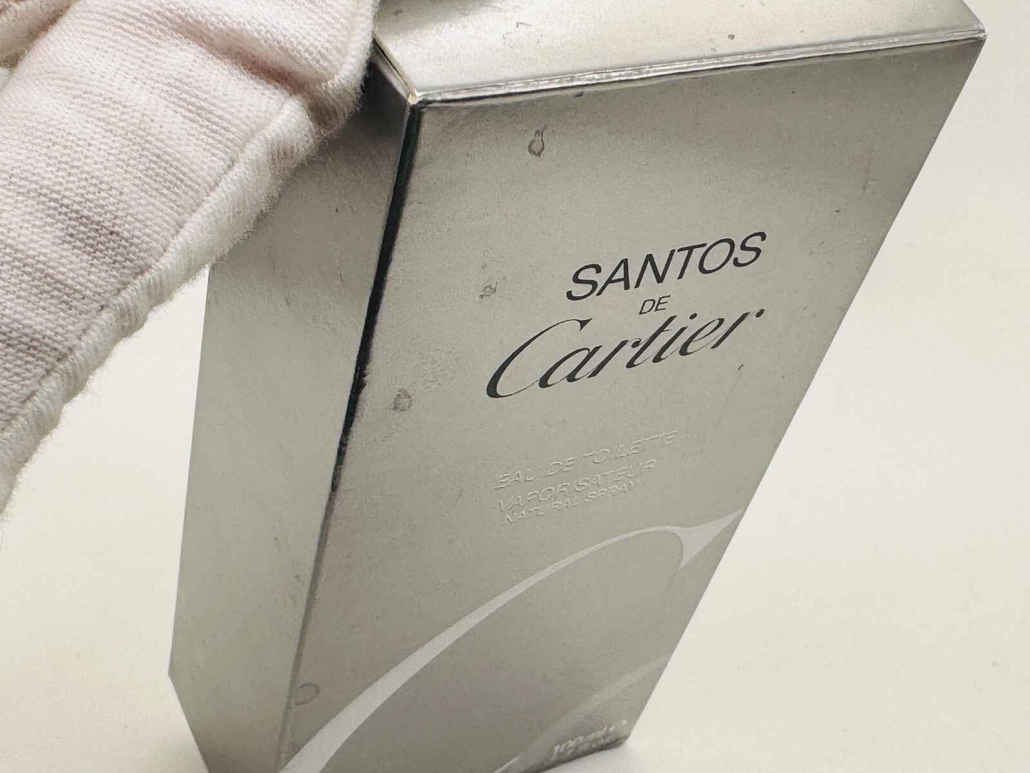 Scatola di profumo Cartier Santos Vintage in metallo con design elegante e logo distintivo