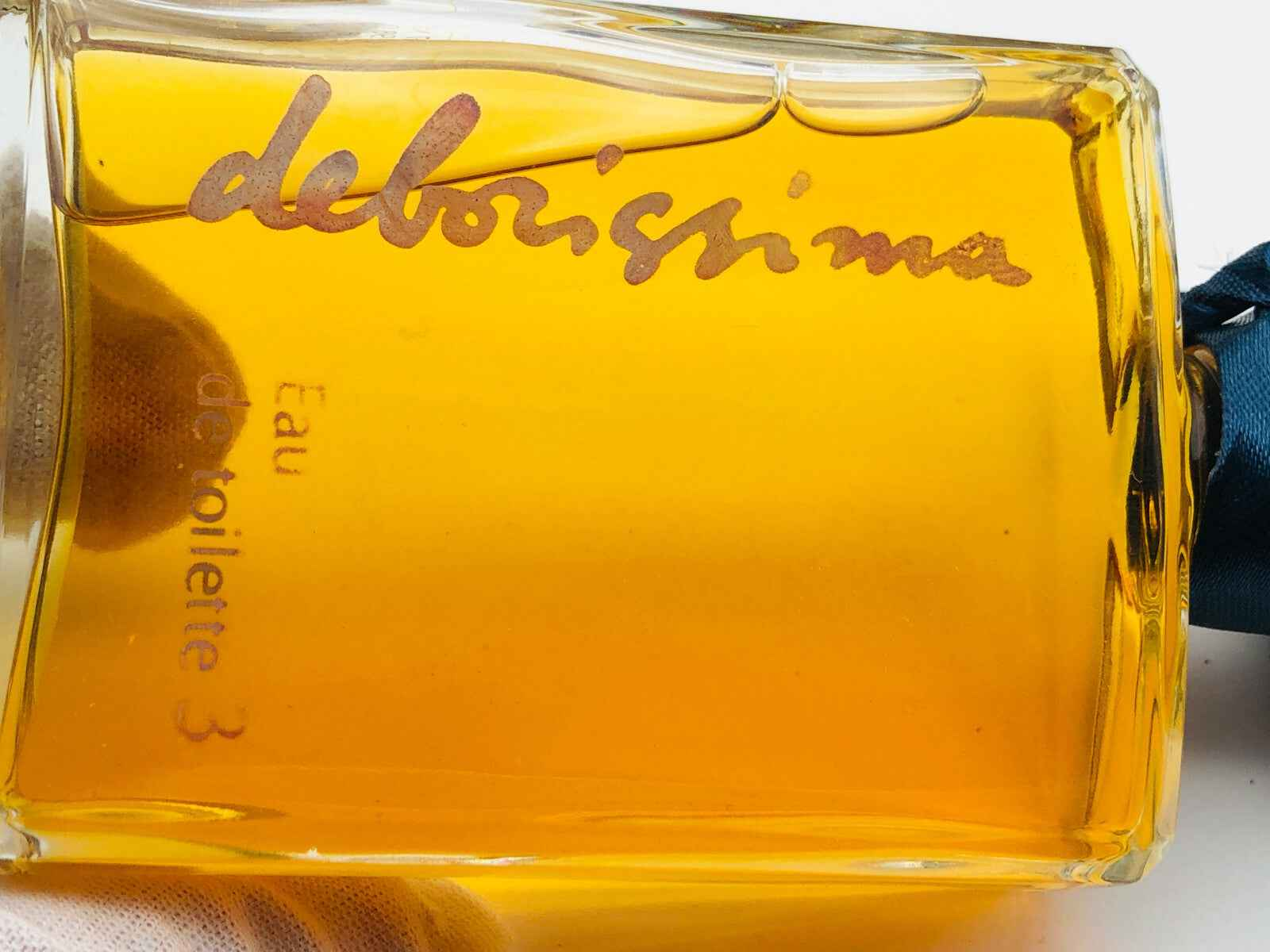 Flacone di profumo Deborah Vintage con etichetta dorata e tonalità di colore ambra
