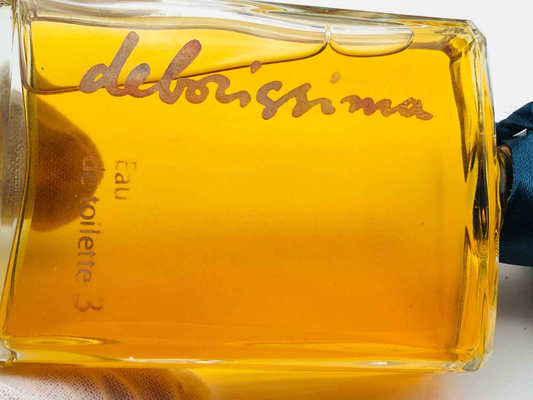 Flacone di profumo Deborah Vintage con etichetta dorata e tonalità di colore ambra