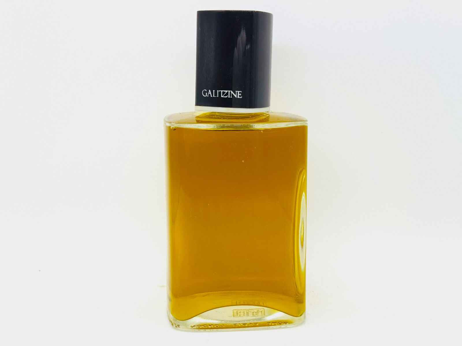 Flacone di Profumo Galitzine Vintage con tappo nero e liquido dorato, elegante e sofisticato