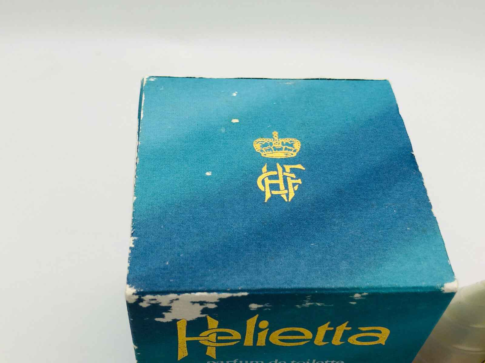 Scatola del Profumo Helietta Caracciolo con design blu e dettagli dorati
