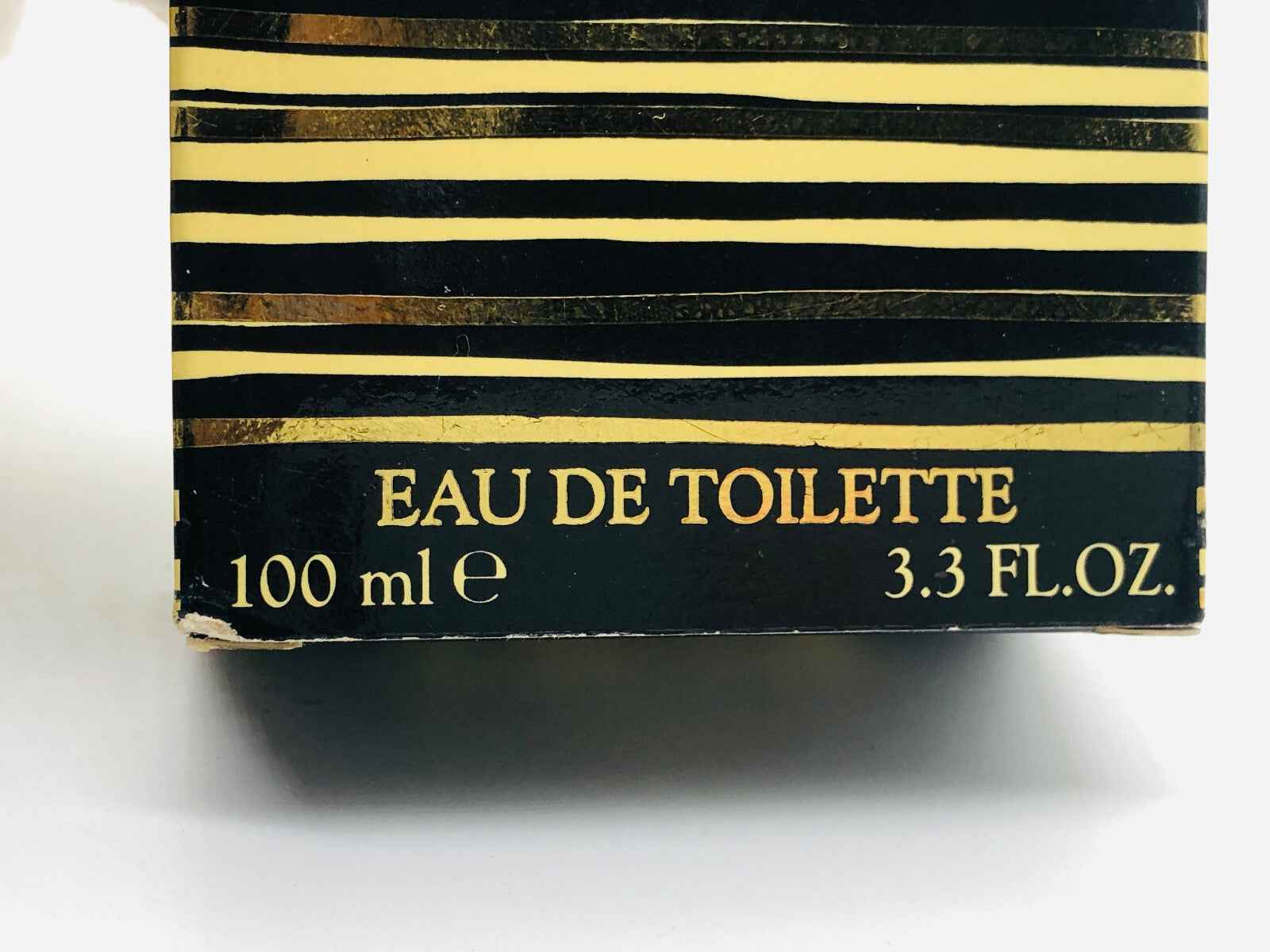 Scatola di profumo Ivoire De Balmain Vintage da 100 ml con design elegante a strisce dorate