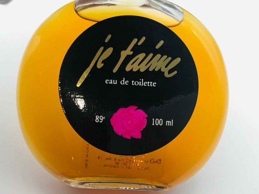 Profumo Je T Aime Vintage in flacone rotondo da 100 ml con etichetta nera e rosa