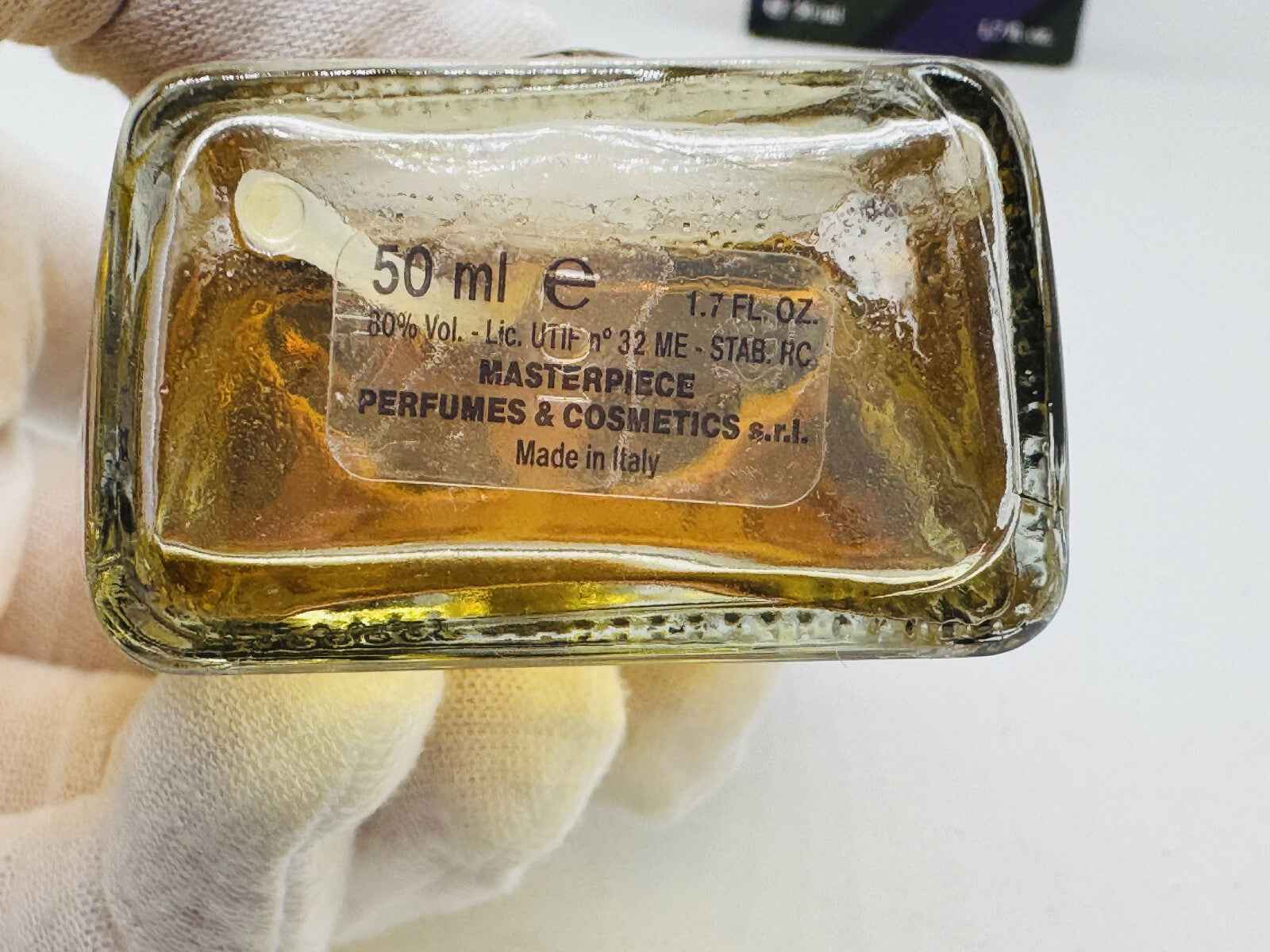 Flacone di profumo Tino Cosma Vintage da 50 ml con etichetta e liquido dorato