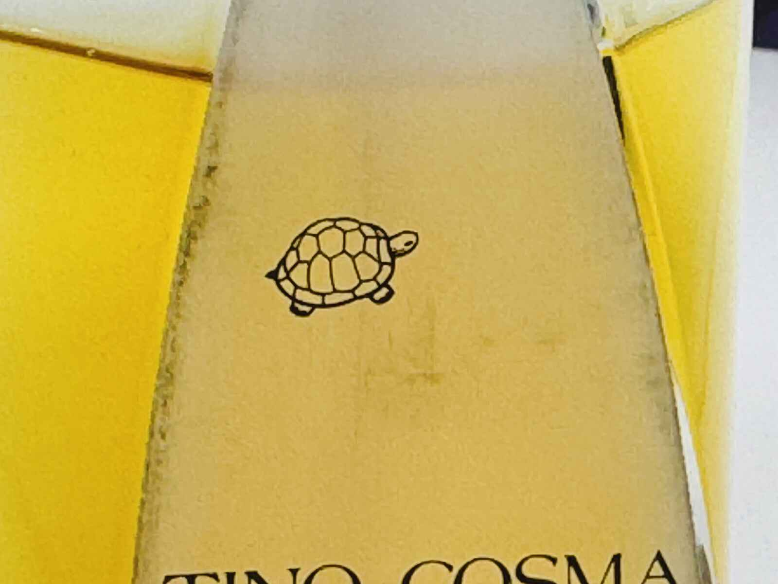 Flacone di profumo Tino Cosma Vintage con etichetta e logo di tartaruga