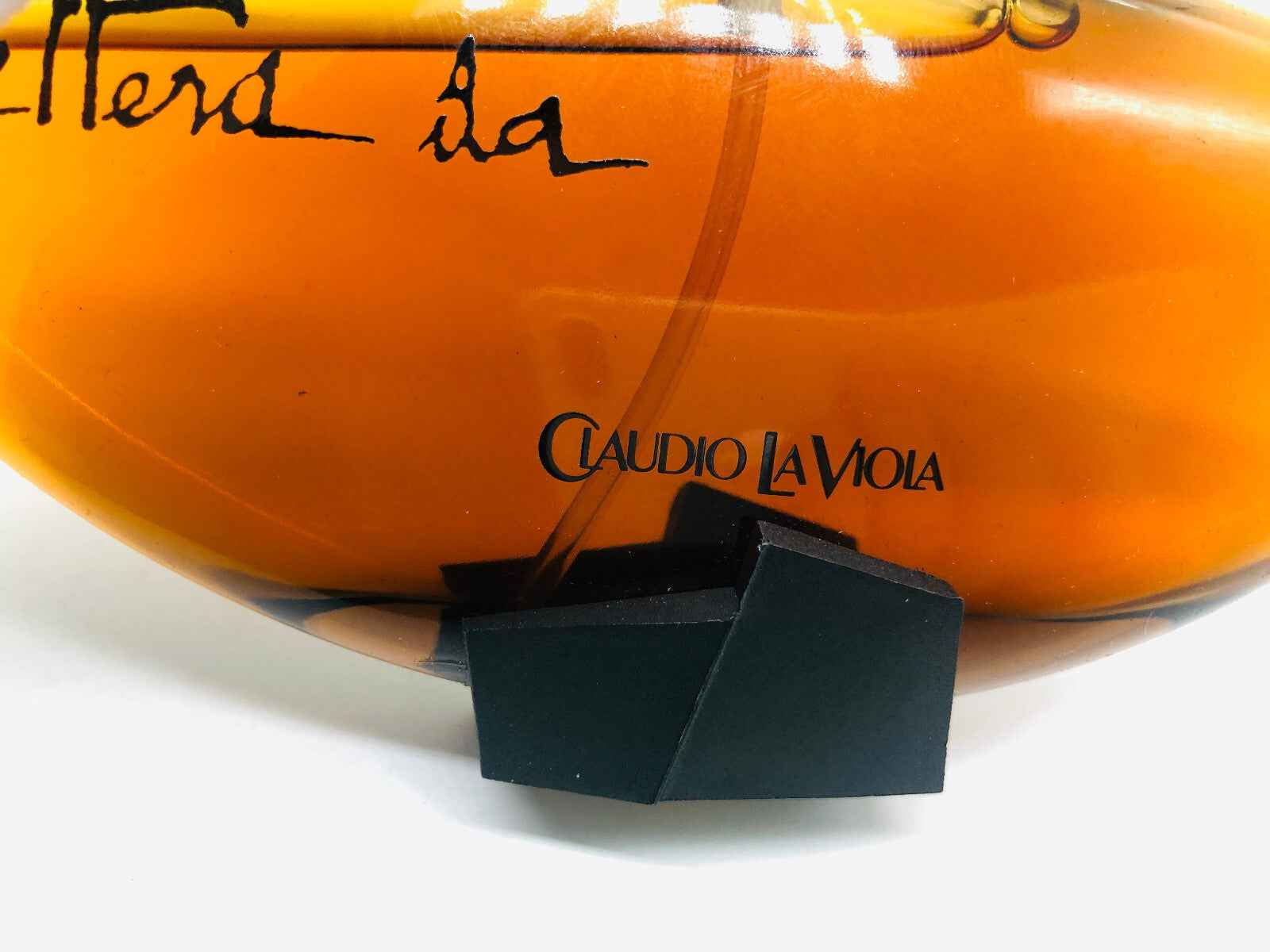 Flacone di profumo vintage Claudio La Viola con etichetta e design elegante in tonalità calde