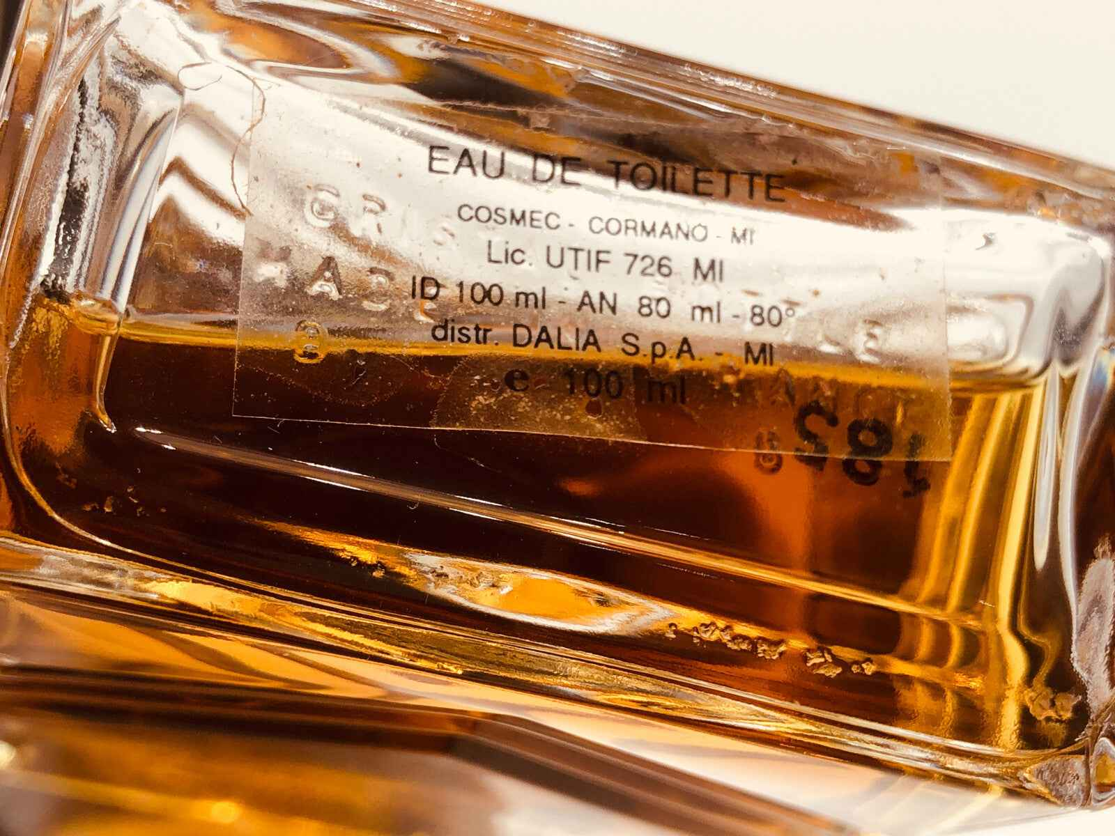 Flacone di profumo vintage Jacques Deville da 100 ml con etichetta dettagliata e colore ambrato