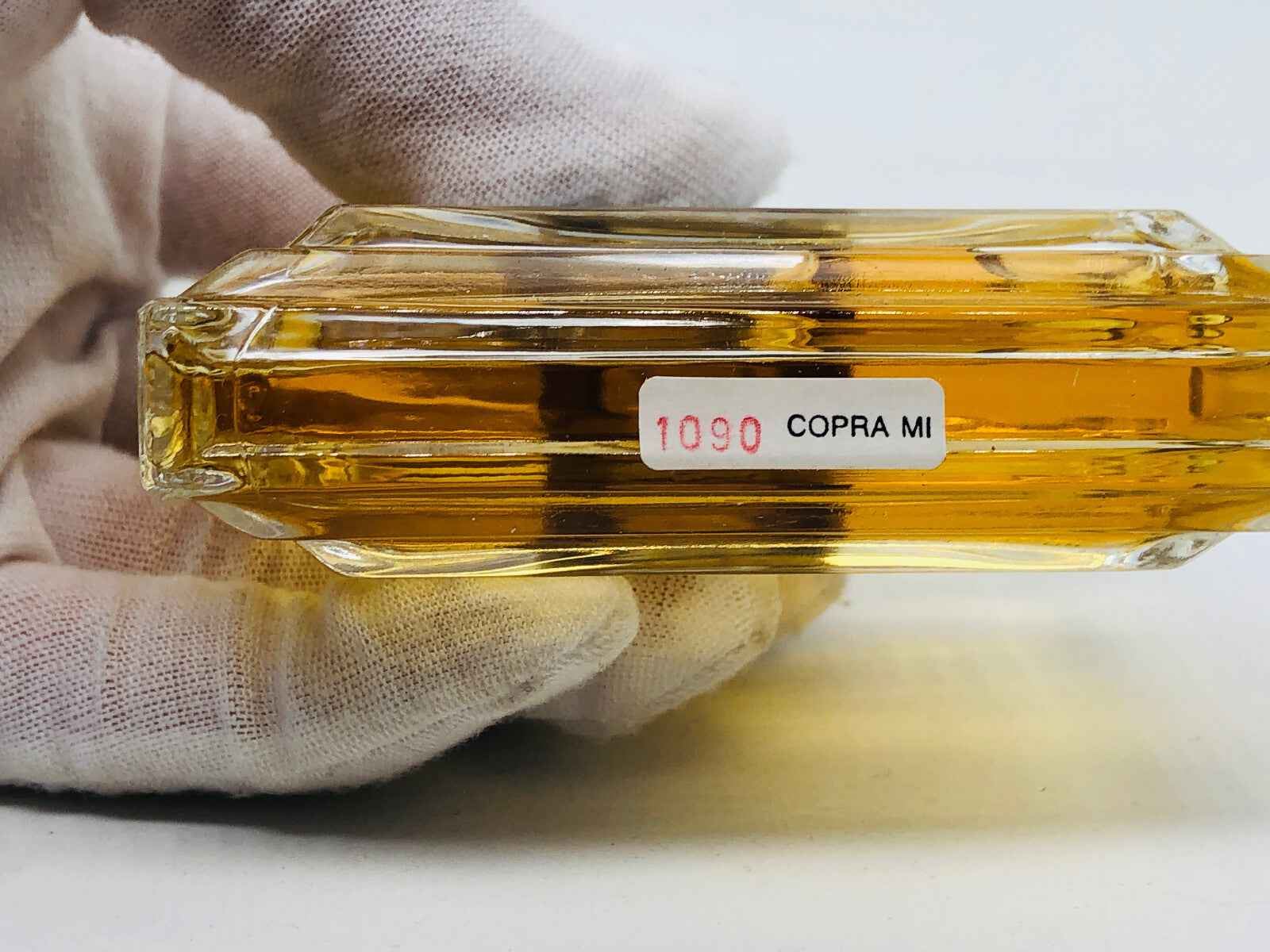 Flacone di profumo Vintage Luciano Soprani con liquido dorato e etichetta distintiva