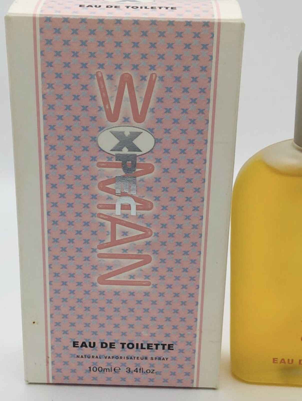 Profumo Xpec Woma in flacone da 100ml con confezione elegante e design moderno