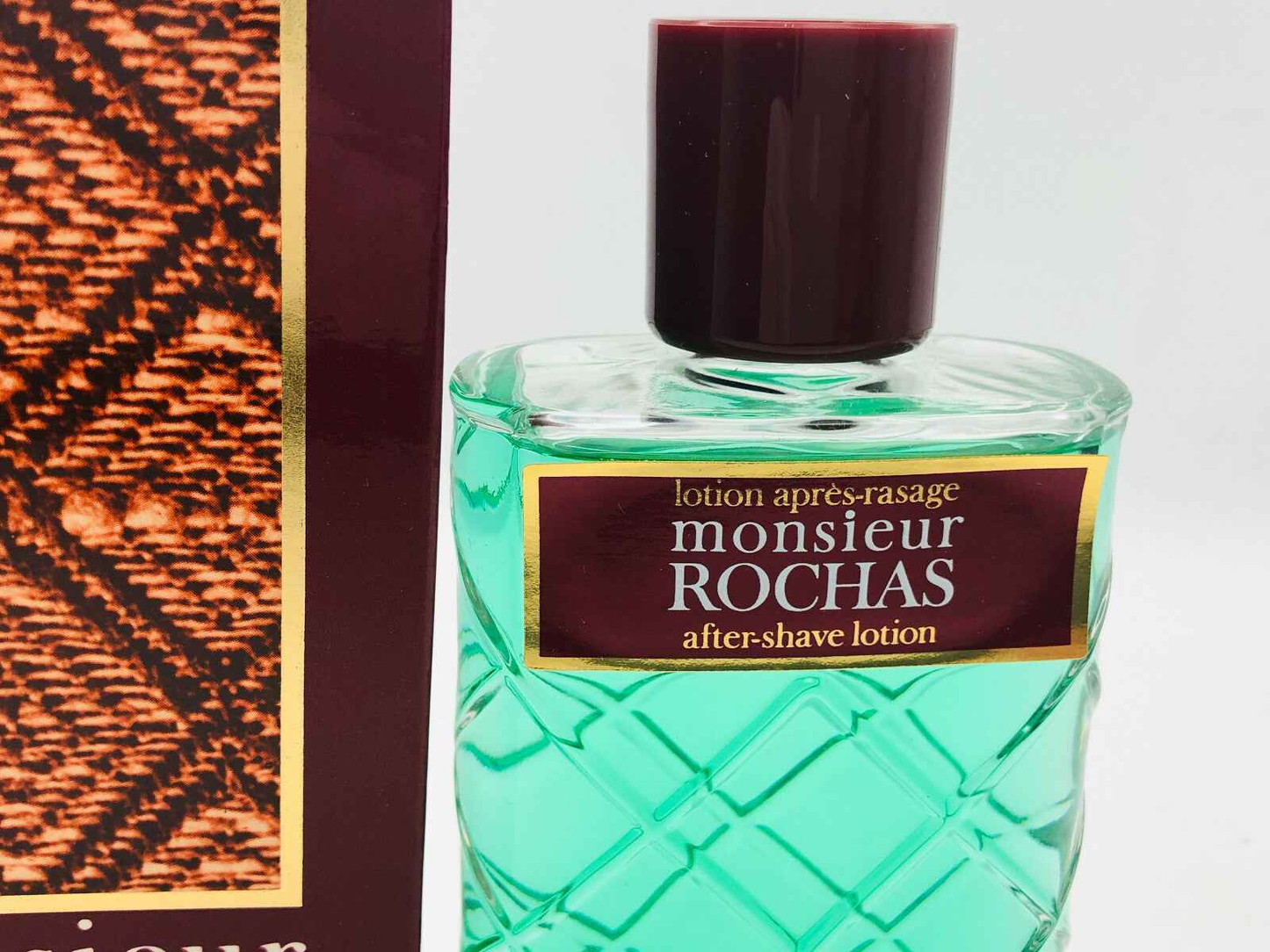 Lotion après-rasage Rochas Monsieur Vintage in bottiglia trasparente con etichetta elegante
