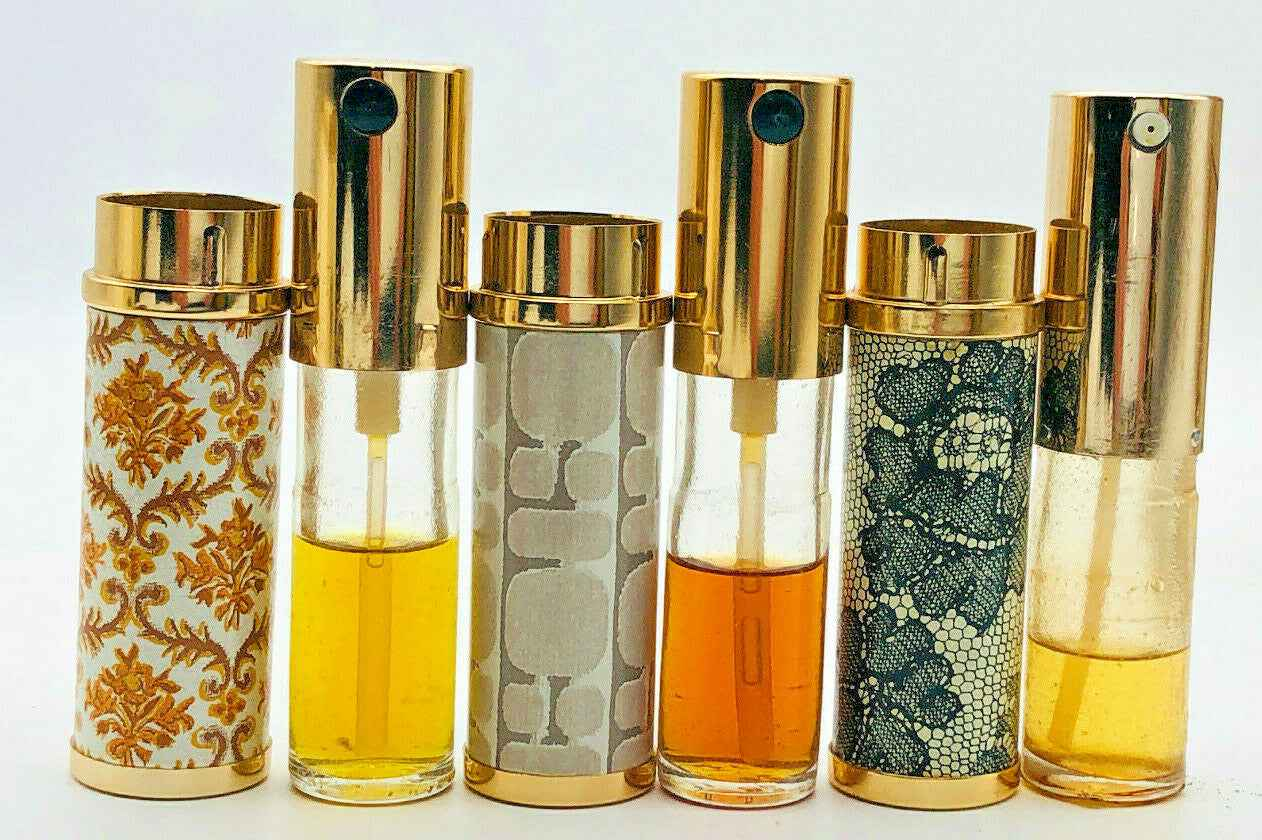 Collezione di flaconi di Rochas Parfum Extrait Vintage con design elegante e raffinato
