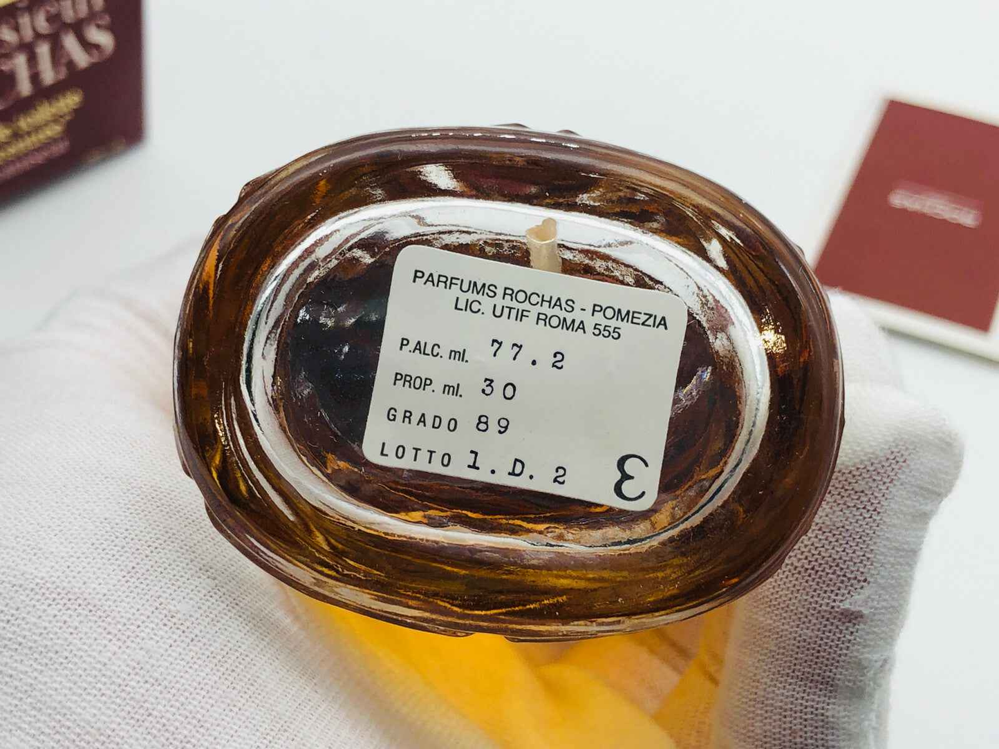 Base del flacone di Profumo Rochas Monsieur Vintage con etichetta e dettagli del prodotto