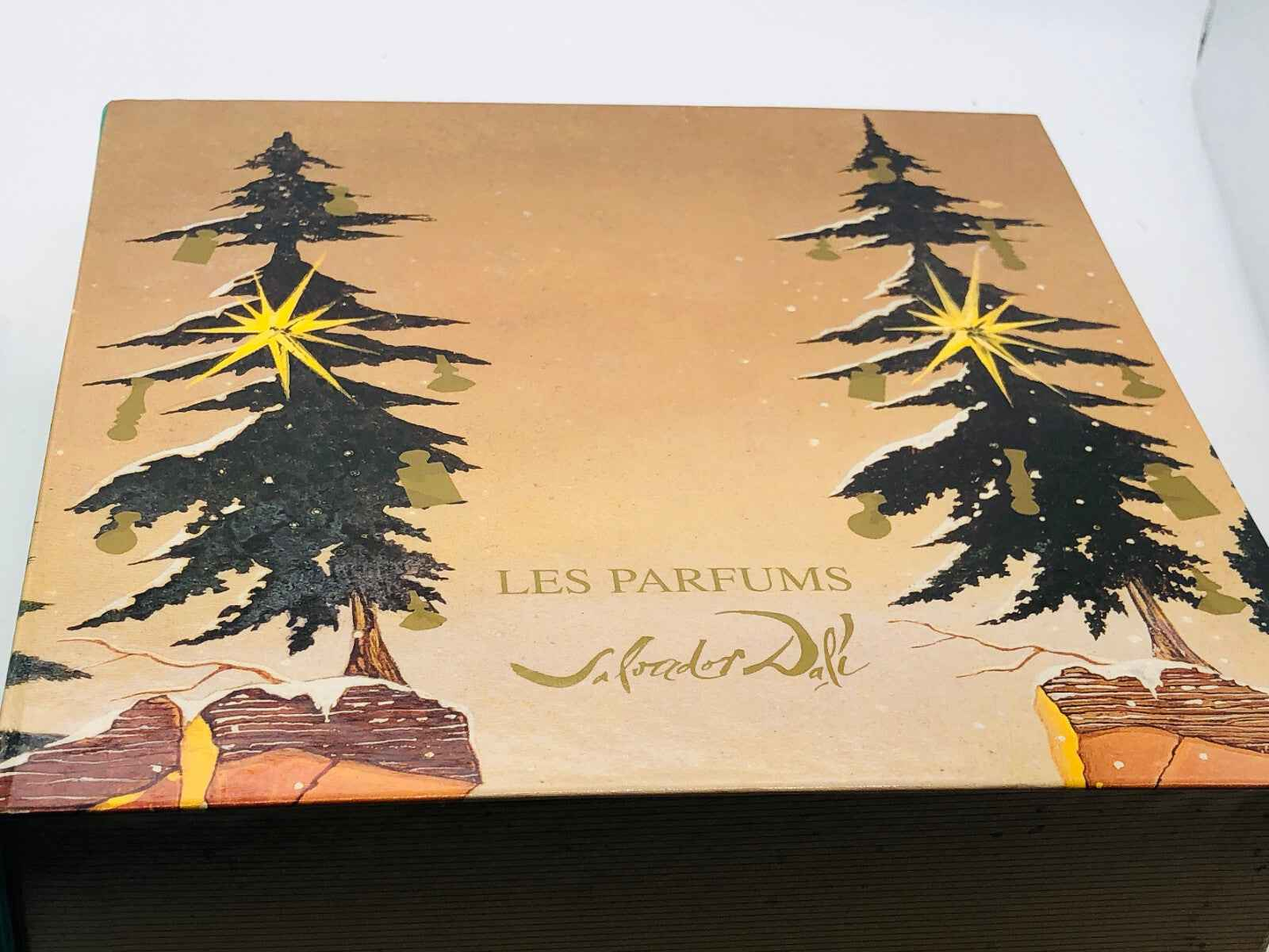 Scatola del profumo Le Roy Soleil Salvador Dali con illustrazioni artistiche di alberi e stelle luminose