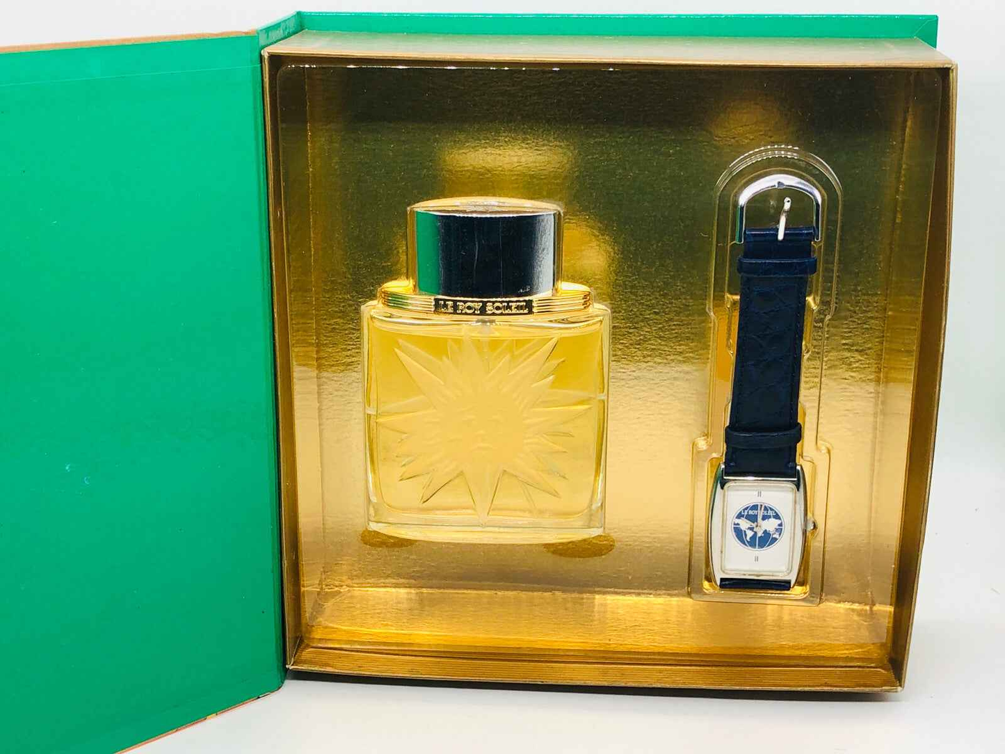 Confezione del profumo Le Roy Soleil Salvador Dali con flacone dorato e orologio elegante