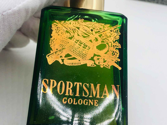 Bottiglia di Sportsman Cologne Vintage con design dorato e verde, ideale per gli amanti delle fragranze classiche