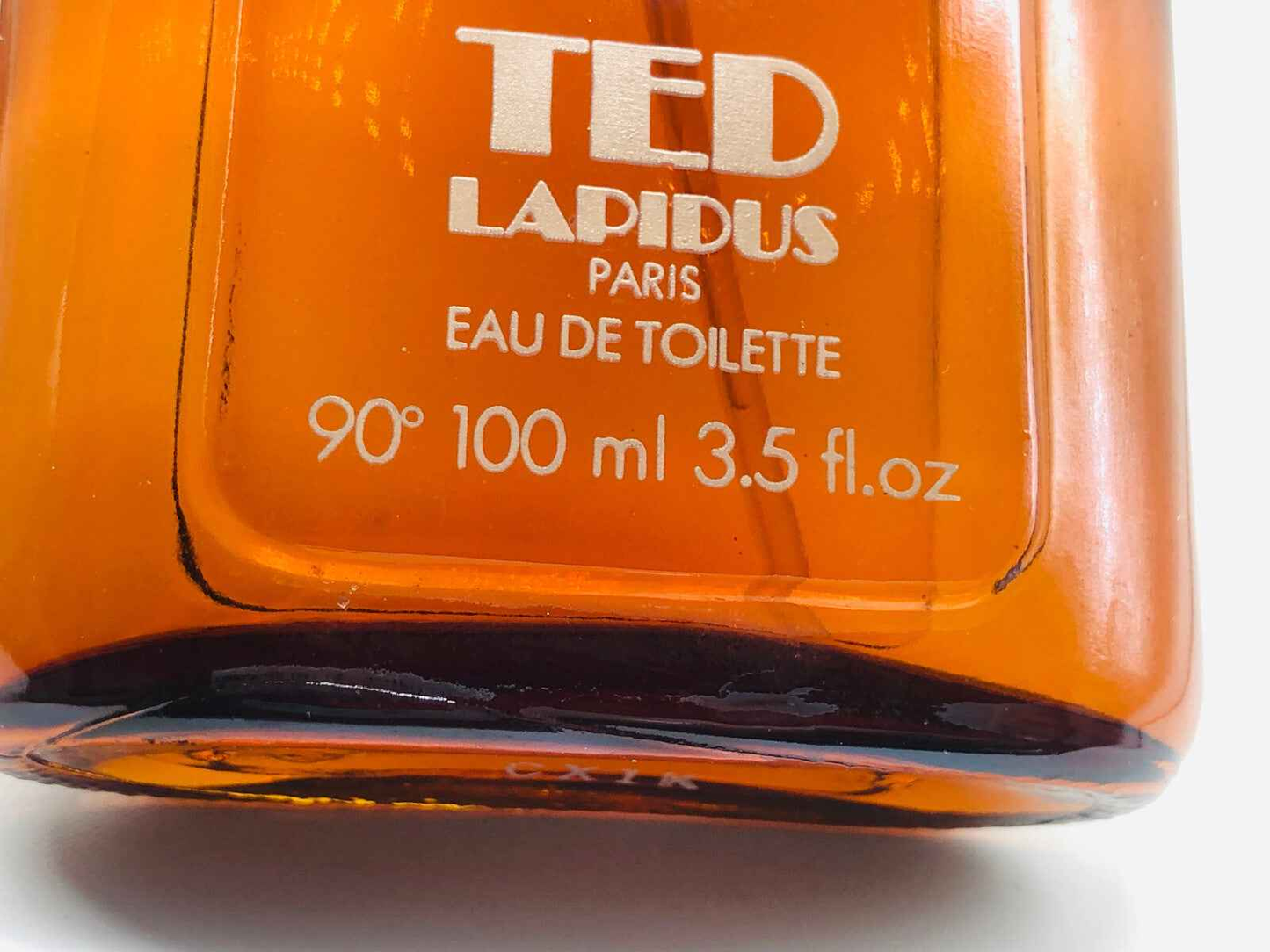 Flacone di Eau de Toilette Ted Lapidus Pour Homme Vintage da 100 ml in vetro arancione