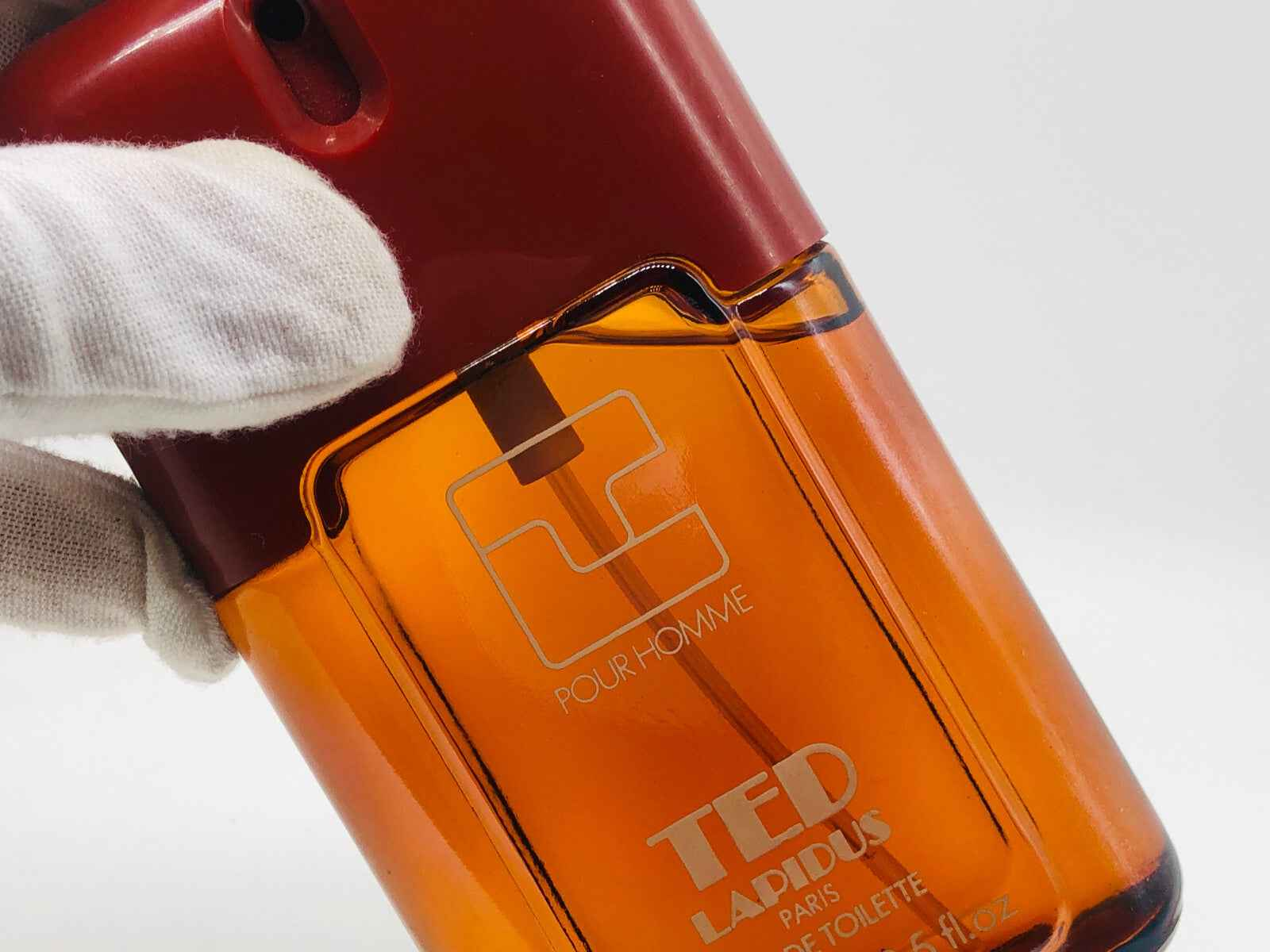 Flacone di profumo Ted Lapidus Pour Homme Vintage con design elegante e arancione per uomini sofisticati
