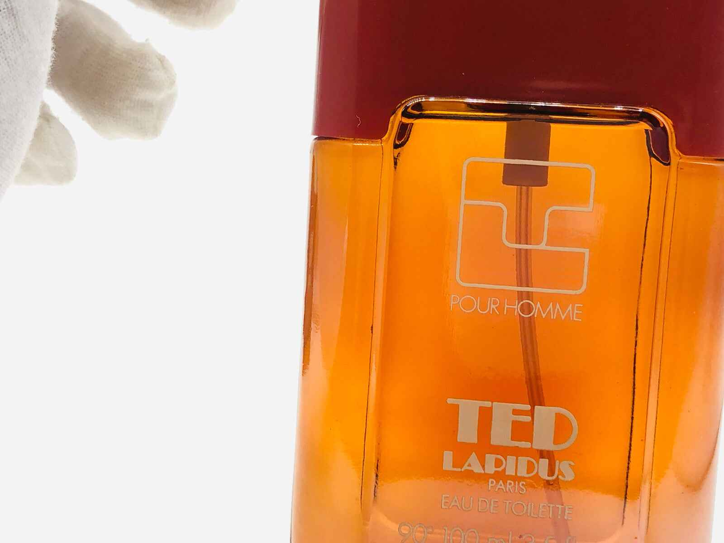 Profumo Ted Lapidus Pour Homme Vintage in flacone arancione con erogatore elegante