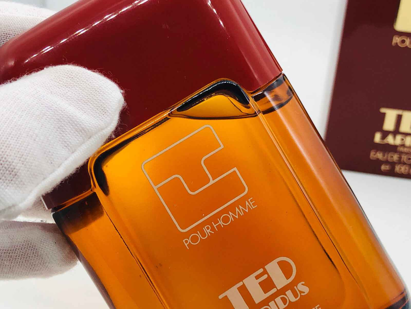 Flacone di profumo Ted Lapidus Pour Homme Vintage con tappo rosso e design elegante