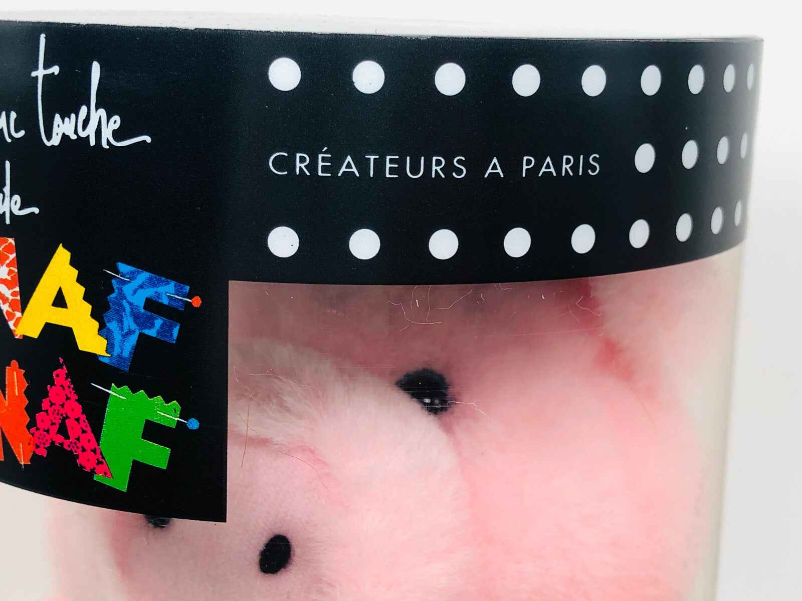 Un Touche Naf Naf Profumo Vintage in confezione trasparente con design colorato e dettagli eleganti