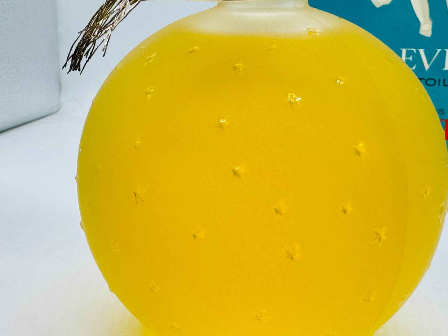 Flacone Worth Je Reviens Vintage in vetro giallo con dettagli eleganti e tappo decorativo