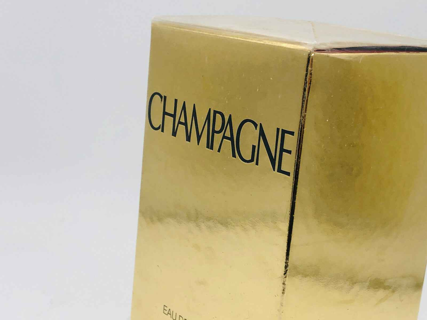 Scatola del profumo Champagne YSL Vintage con finitura dorata e design elegante